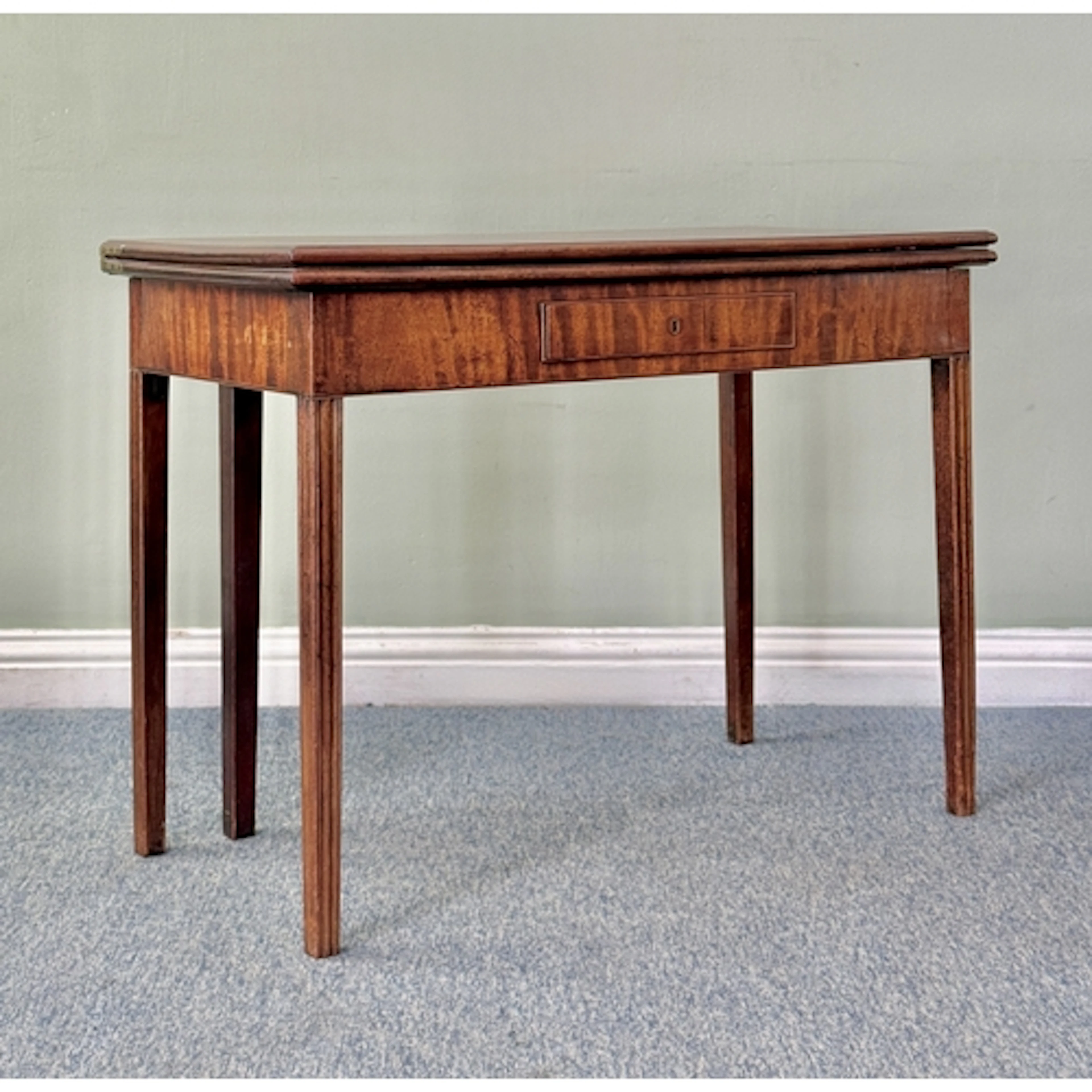 A George III mahogany rectangular fold-over card table - the...