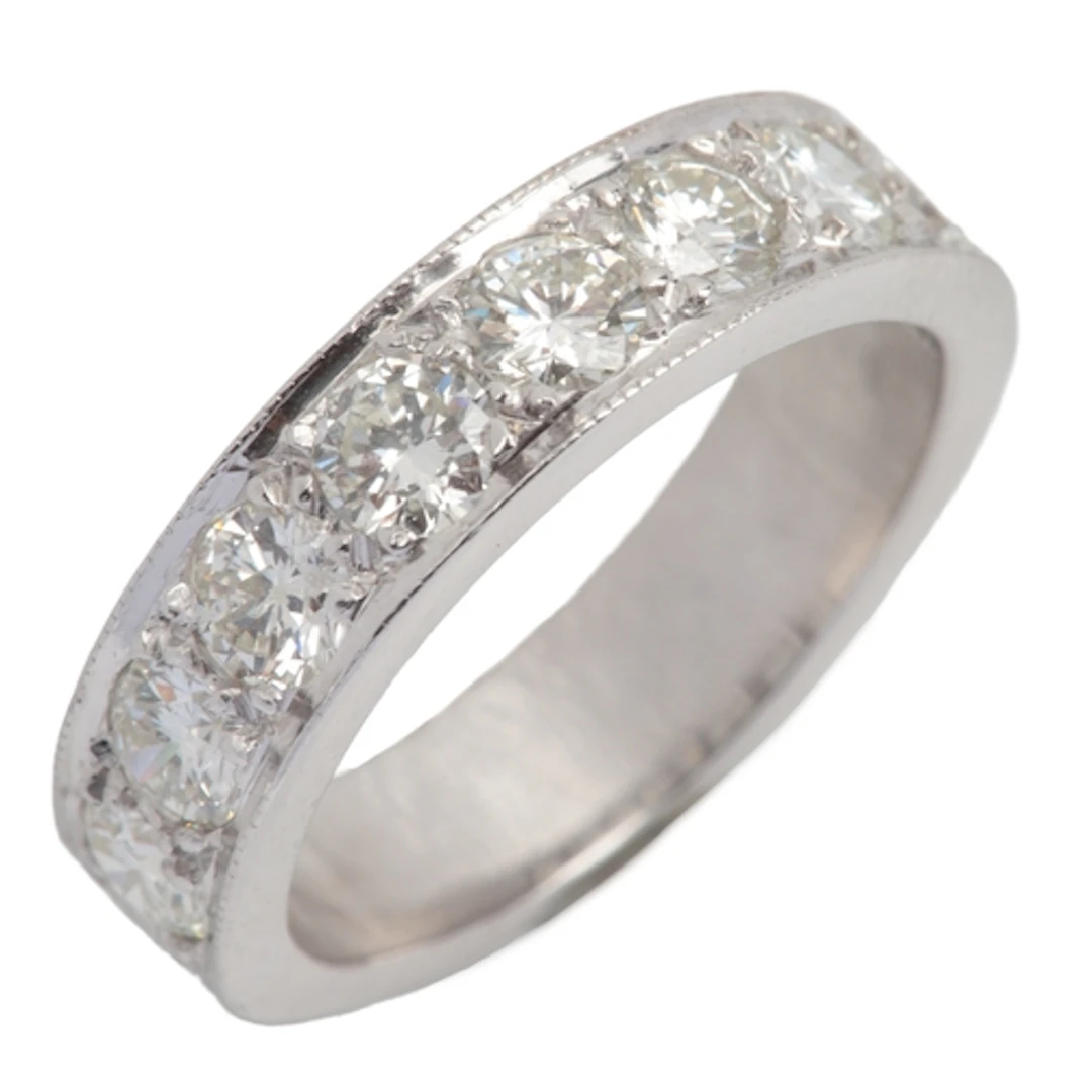 A diamond half eternity ring, set with a sequence of eight b...