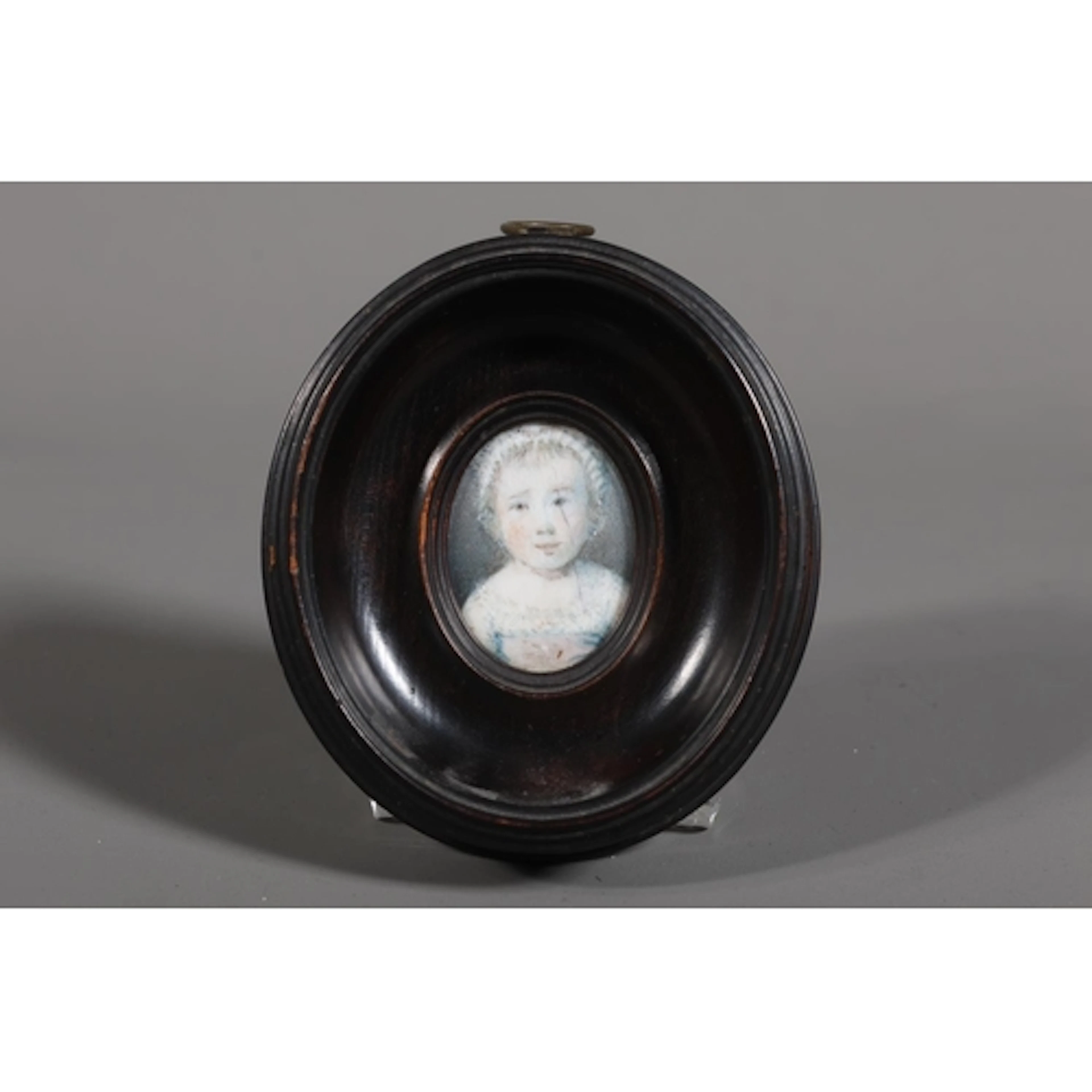 19TH CENTURY SCHOOL Bust length portrait of a young girl ...