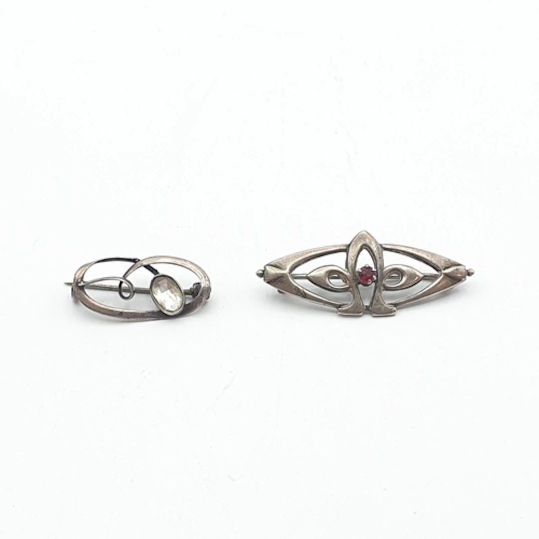 A Charles Horner silver Brooch set red stone and a further s...