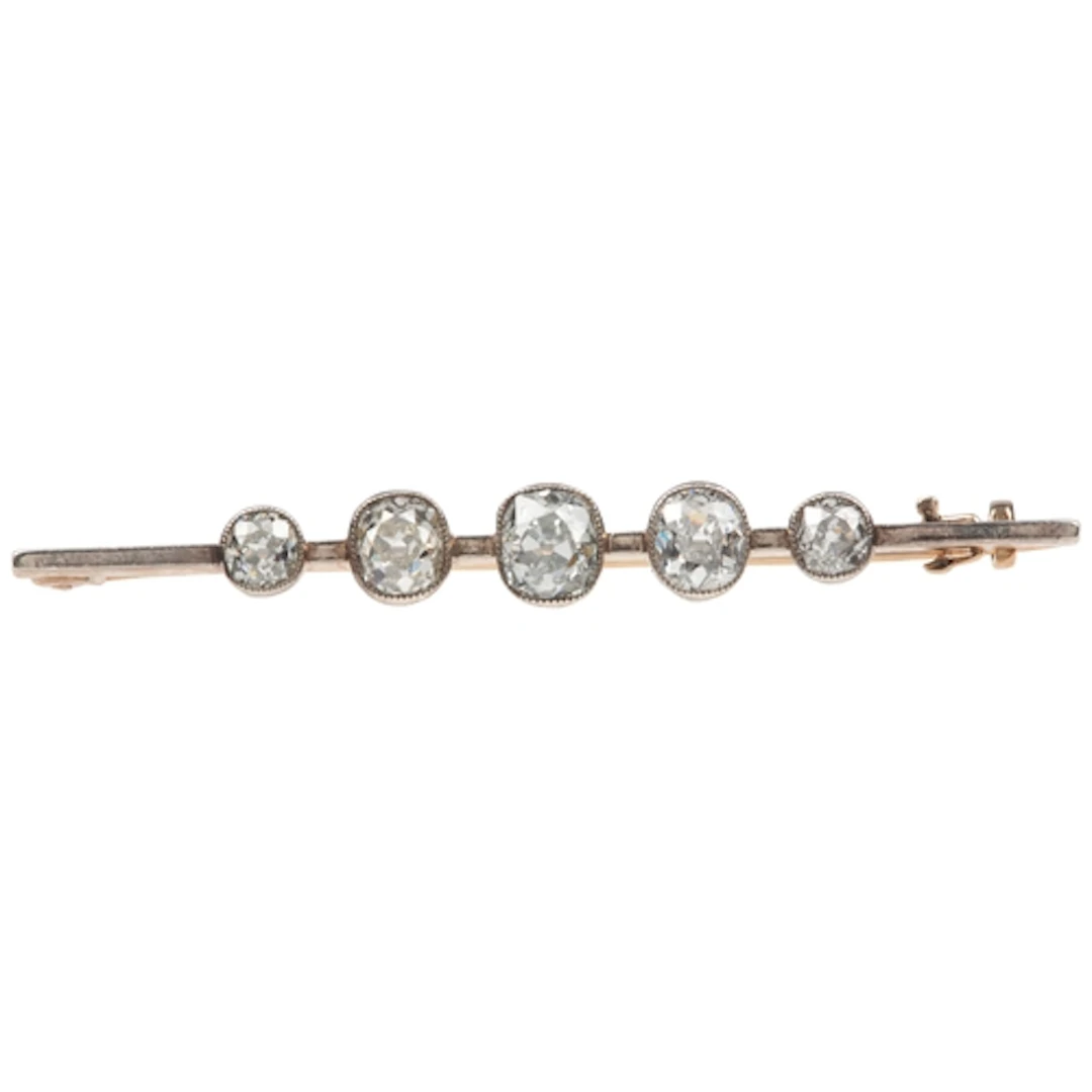 A diamond bar brooch, early 20th century, millegrain-set wit...