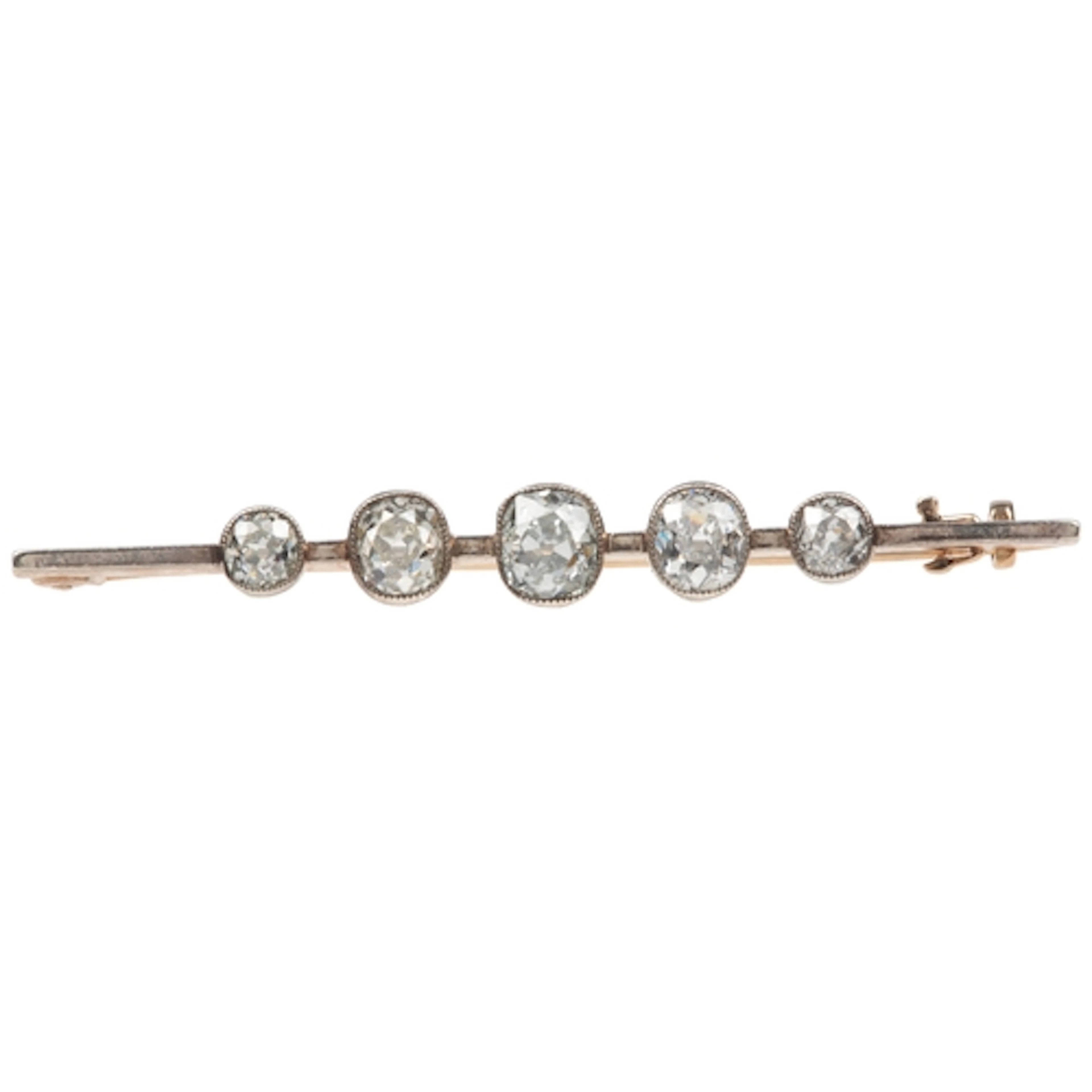 A diamond bar brooch, early 20th century, millegrain-set wit...