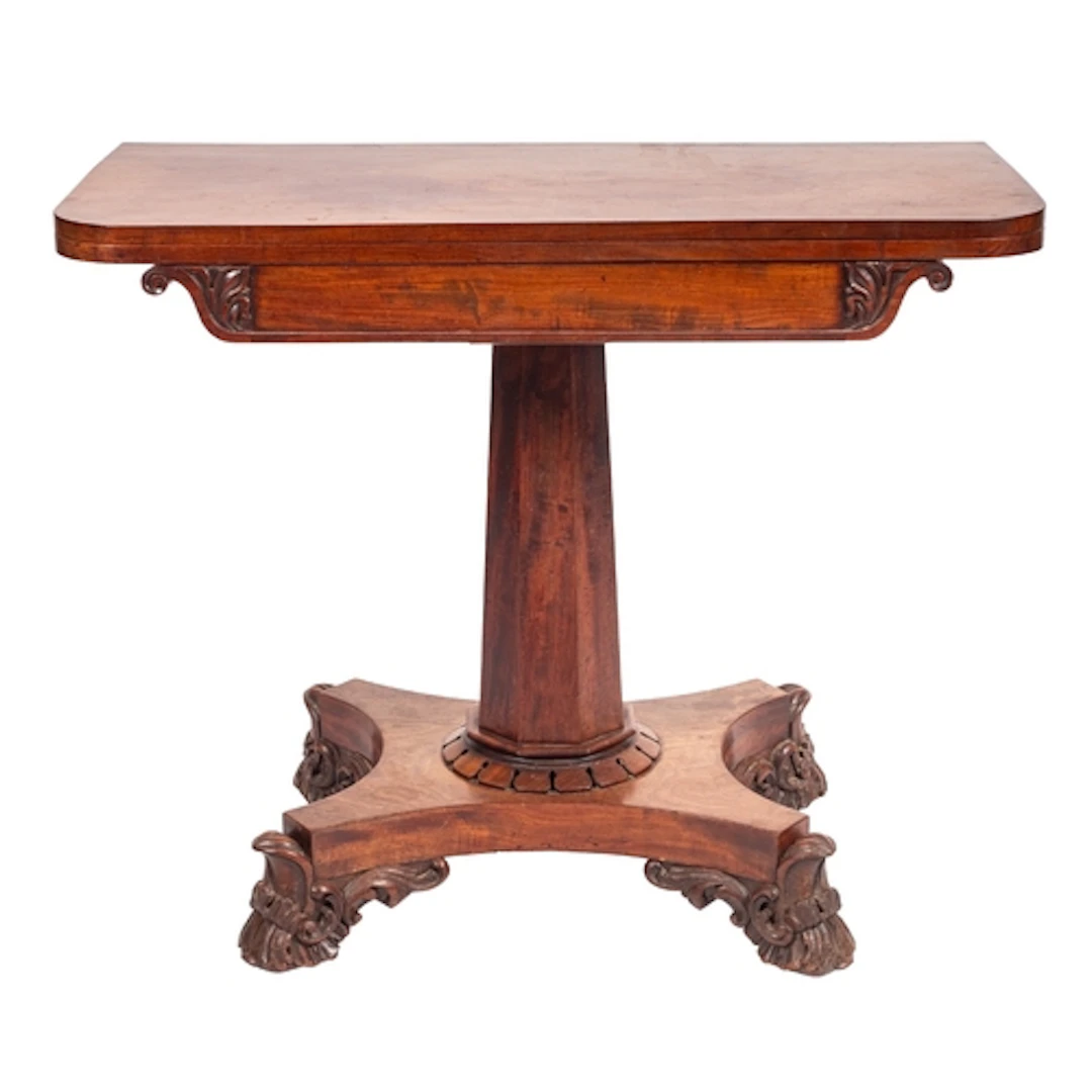 A George IV mahogany tea table, circa 1825; the revolving hi...