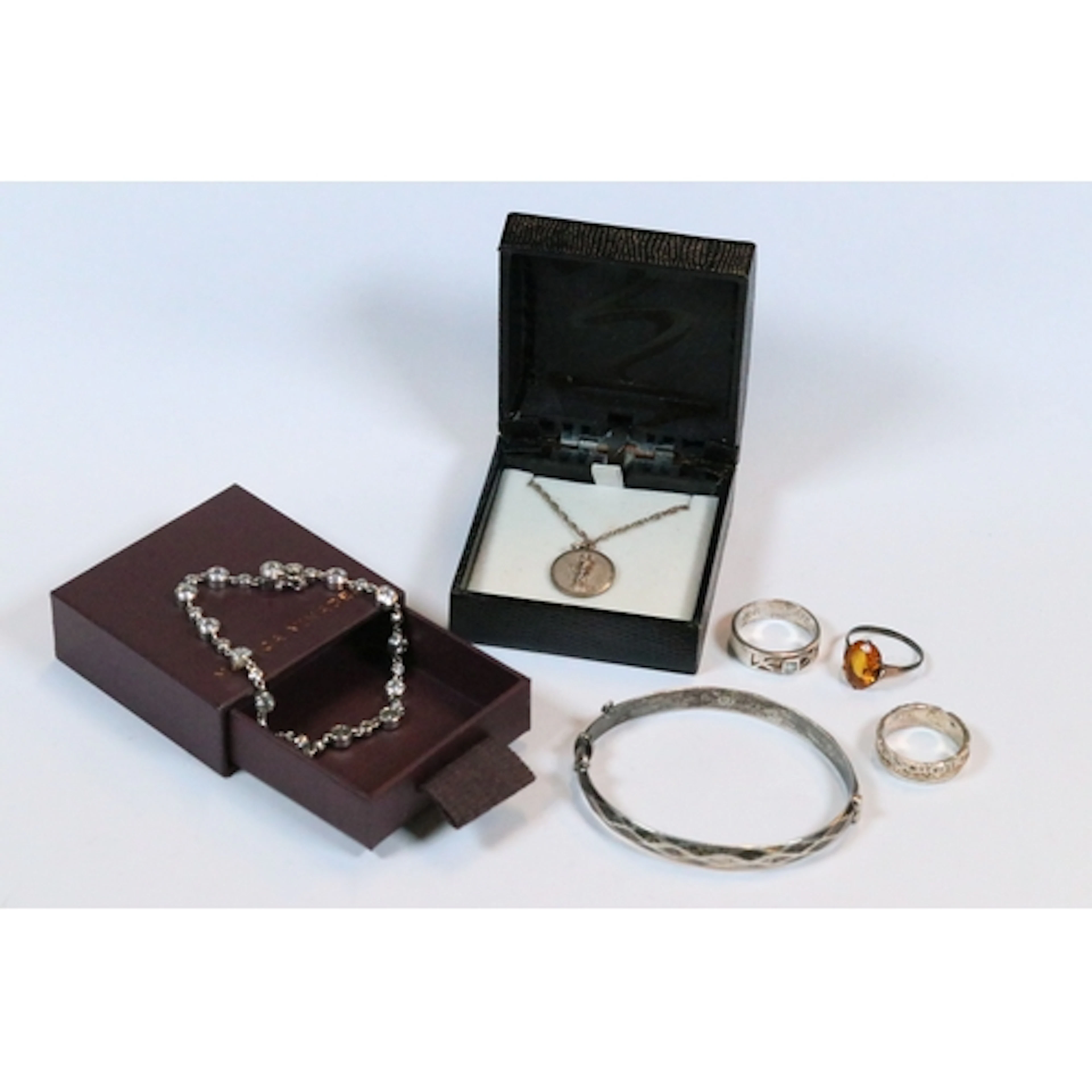 Sterling silver necklace with figural design on a circular p...