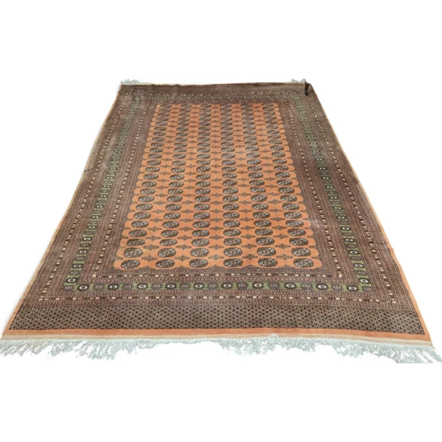 A large Persian Bokhara style Red Rust ground Carpet, with r...