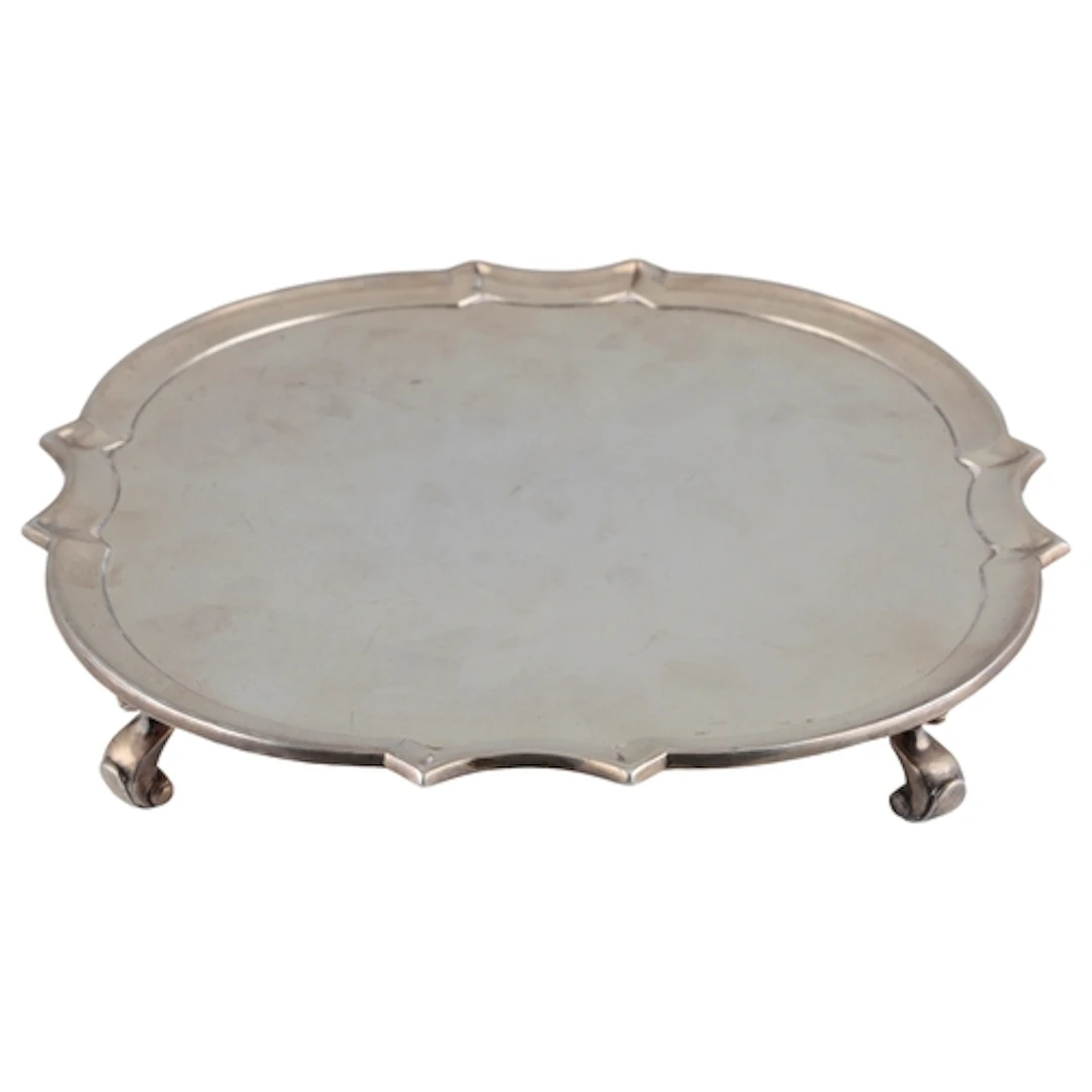 A George VI silver salver, by Mappin and Webb, of shaped cir...