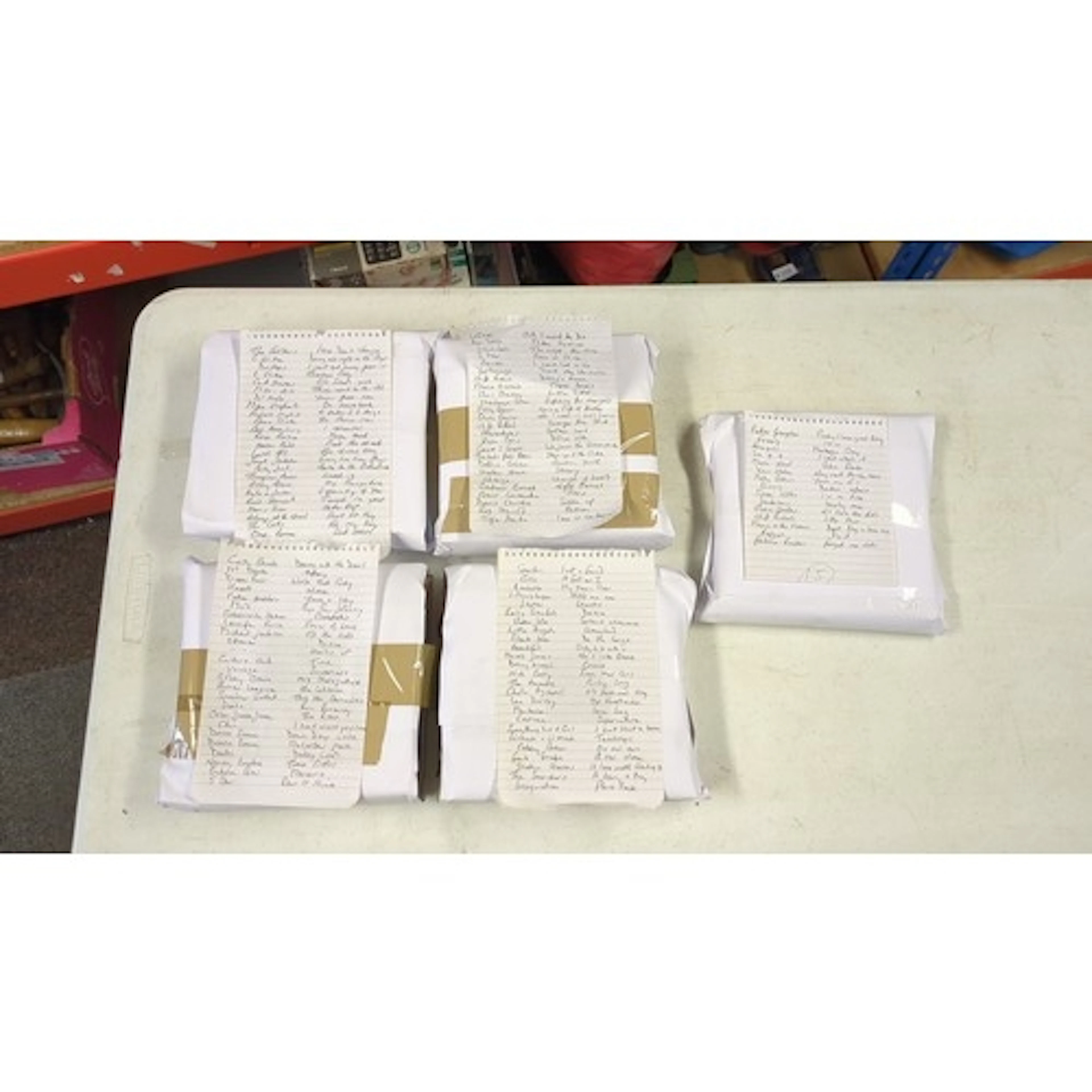 A group 45s with handwritten lyric and song-title sheets, in...