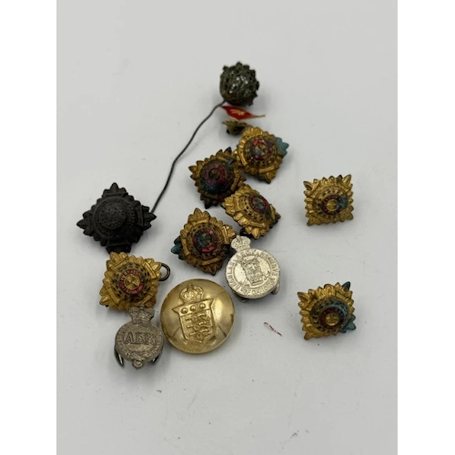 A small selection of military insignia, buttons, badges etc....