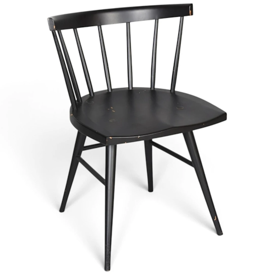 A vintage wooden stick back chair with black paintwork, stam...
