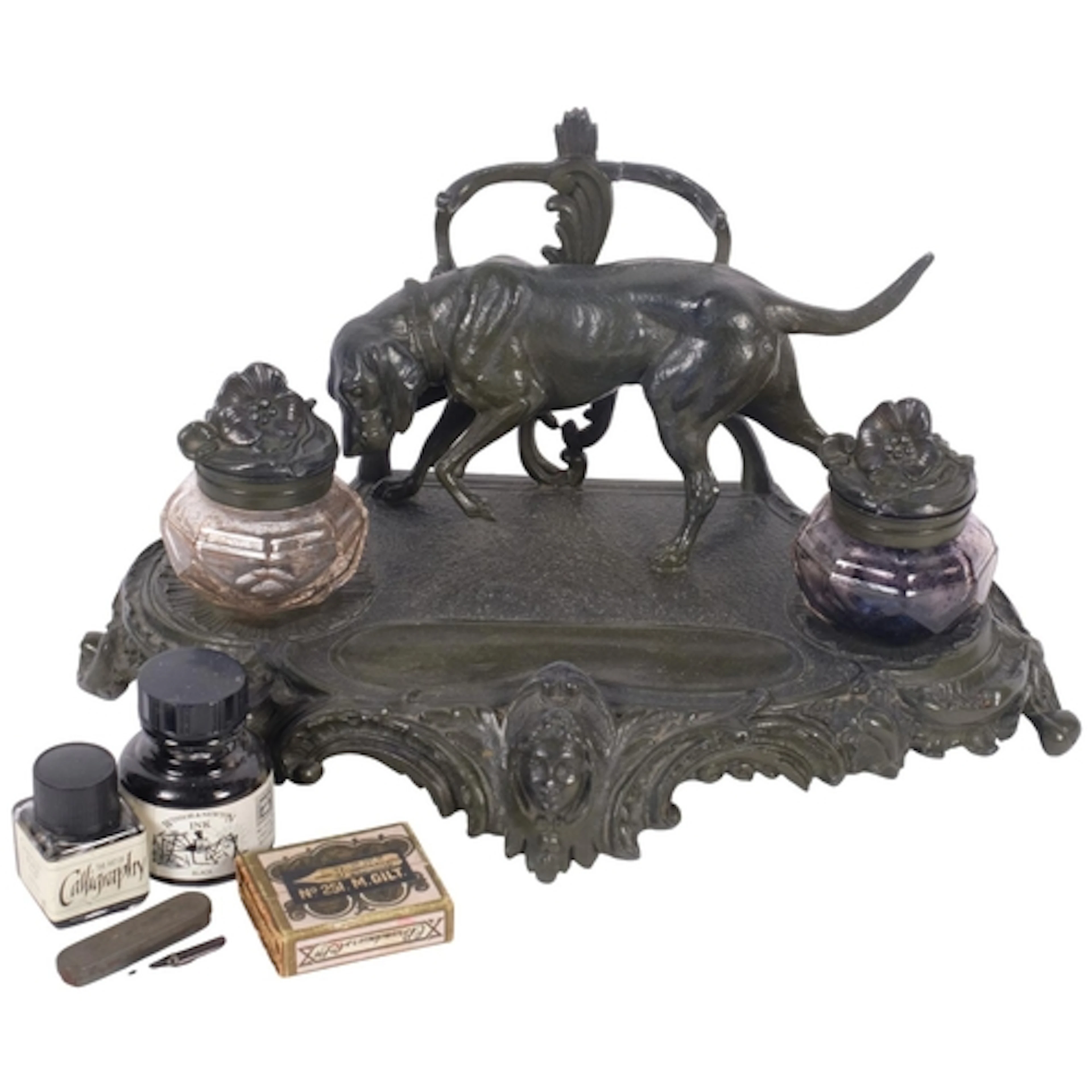 An Antique Continental cast-metal desk stand, surmounted by ...