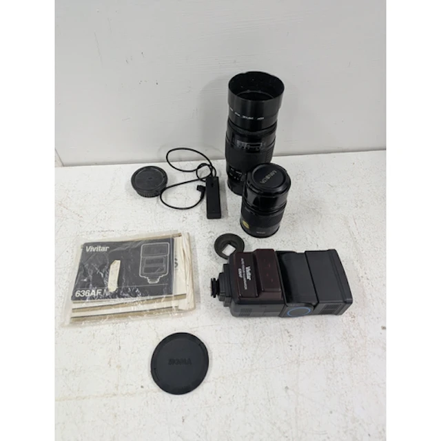 A Sigma zoom 75-200mm f2.8 lens with a 67mm skylight, a Mino...