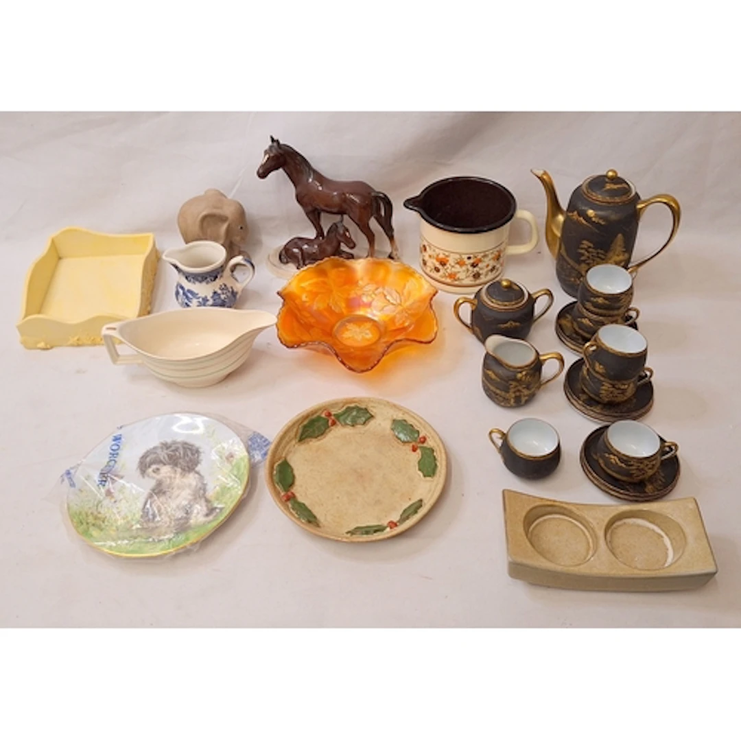 Oriental Tea Wares black ground with gilded landscape scenes...