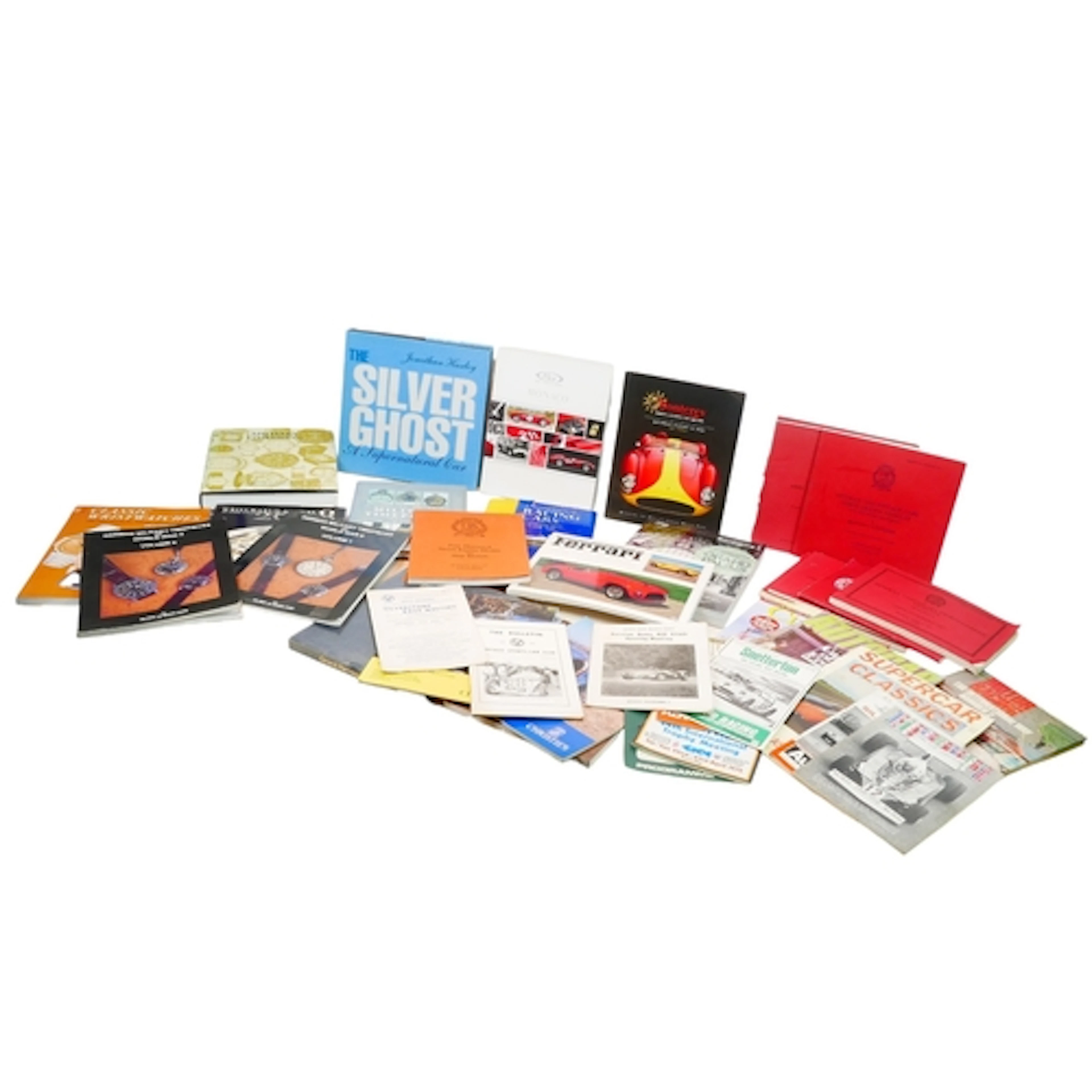 A COLLECTION OF AUTOMOBILIA AND WRISTWATCH BOOKS AND CATALOG...