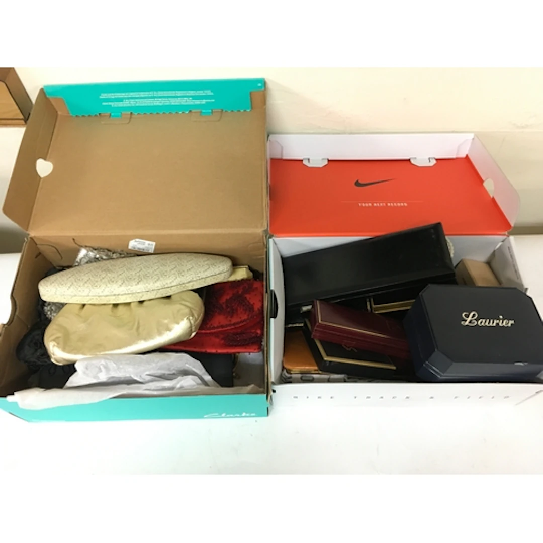Two boxes of costume jewellery including compacts, necklaces...
