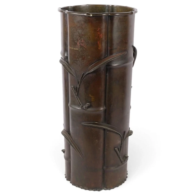 A Japanese bronze bamboo design stick stand, with relief mou...