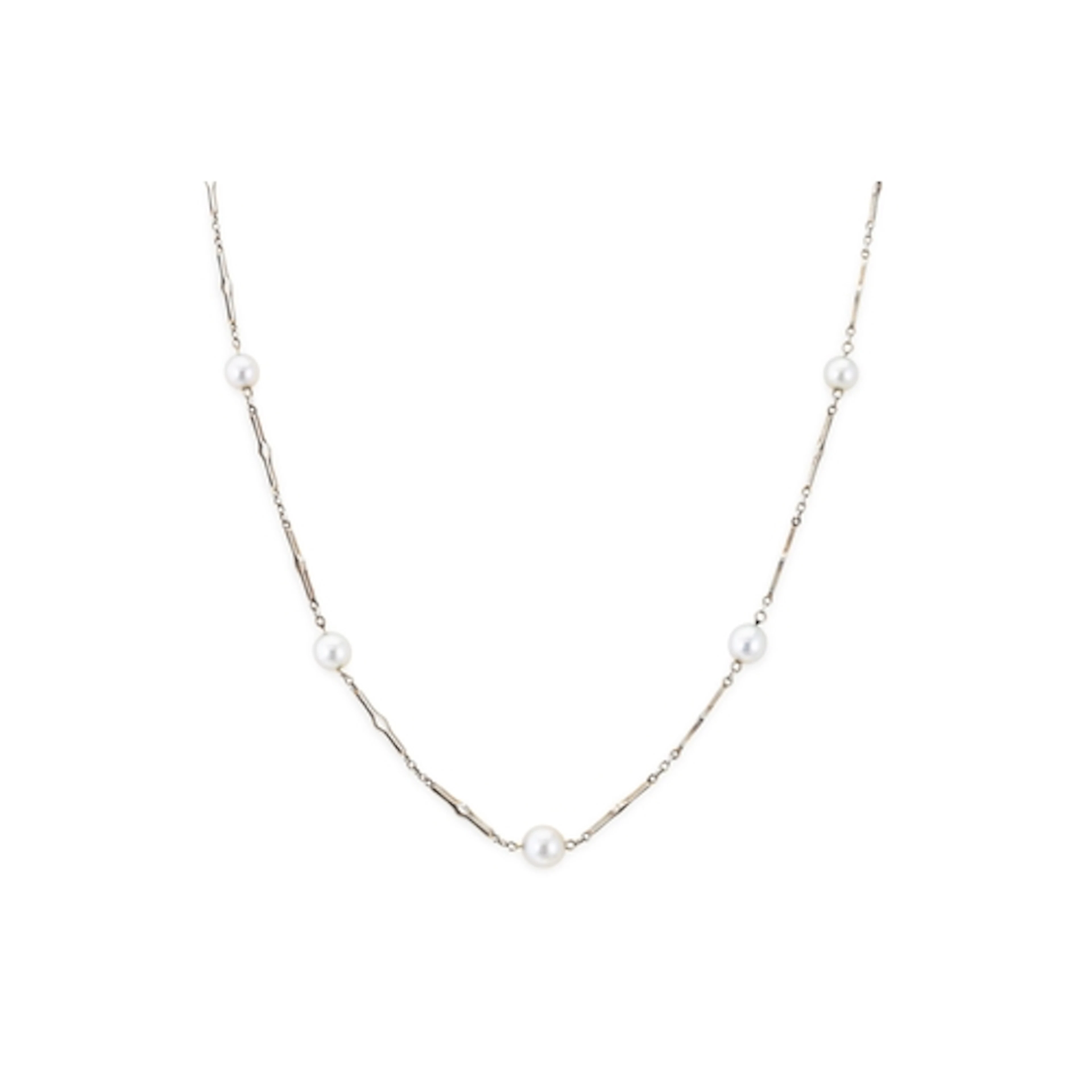 AN ART DECO 18CT WHITE GOLD STATION NECKLACE, set with seven...