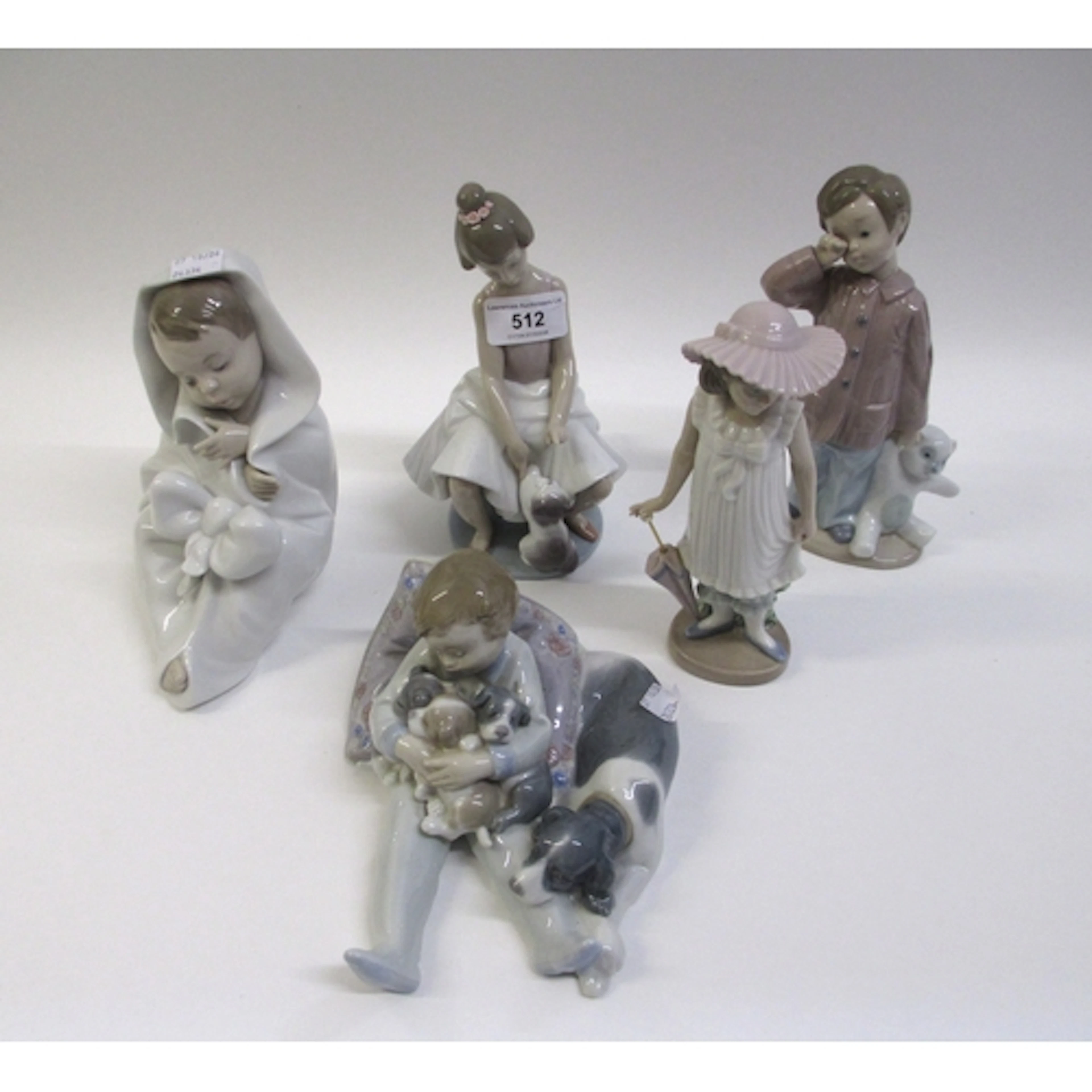 Two Lladro figures of children, together with three Nao figu...