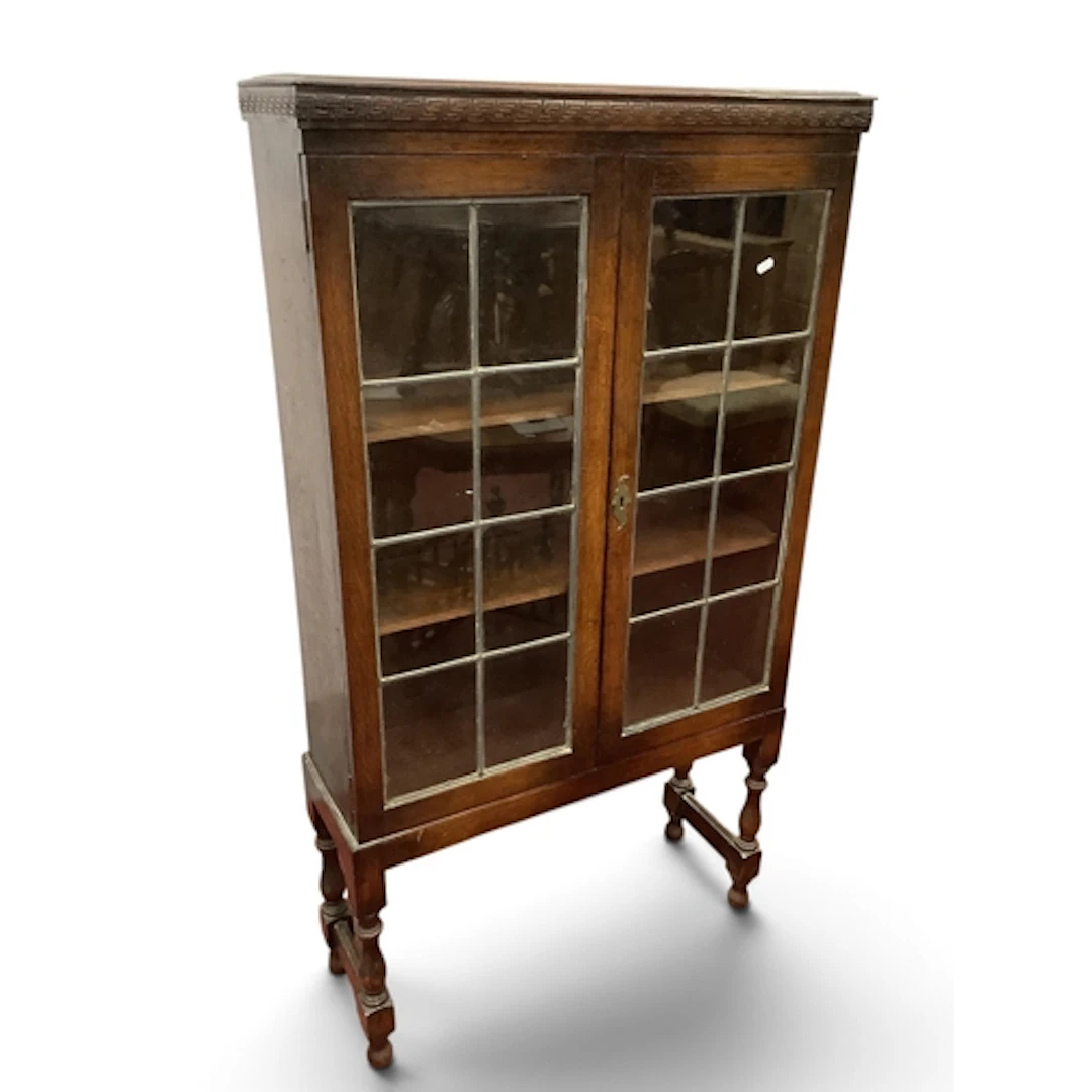 1920s Oak Book Cabinet, with twin lead glazed doors on turne...
