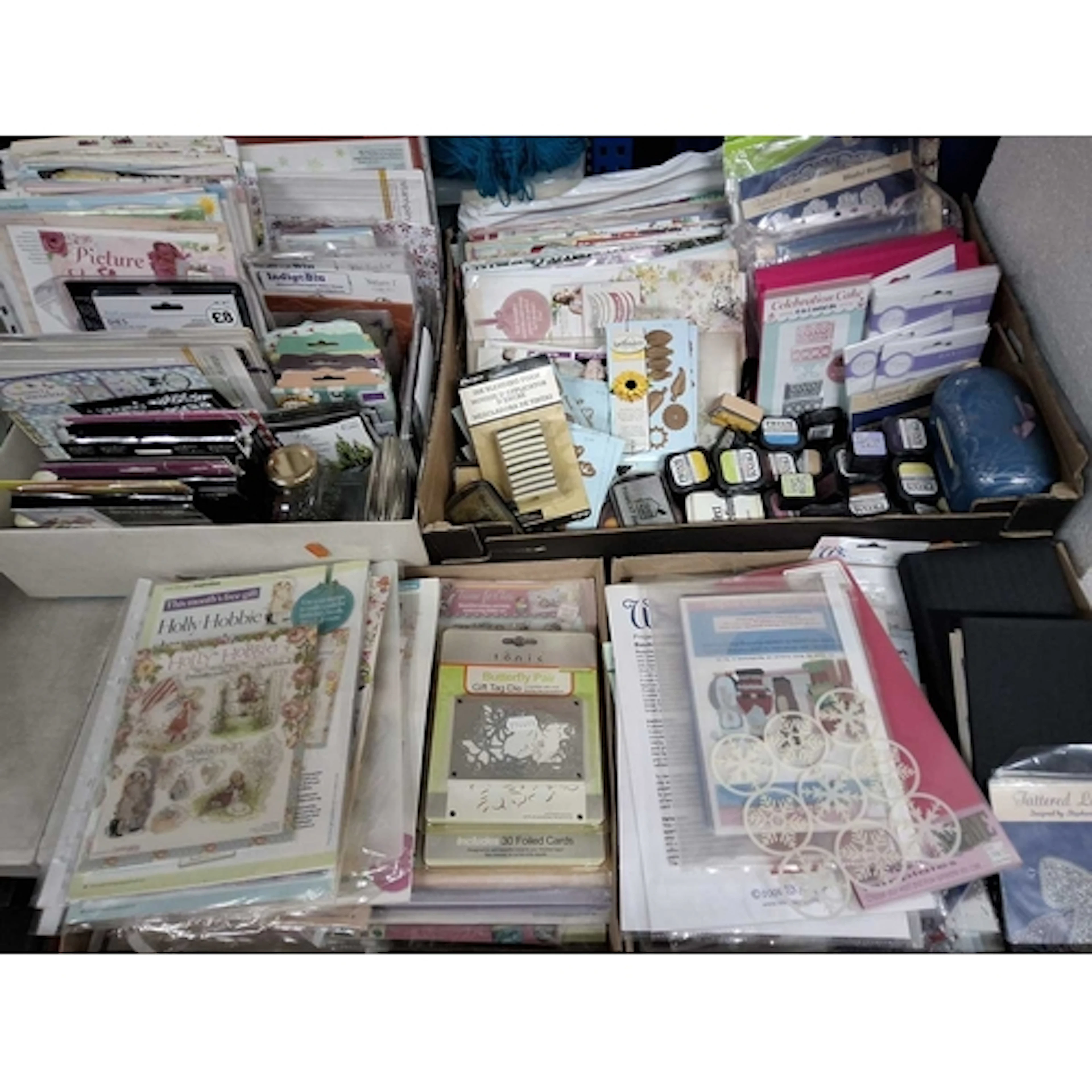 FOUR BOXES OF DIE-CUTTING, STAMPING AND OTHER PAPERCRAFT SUP...