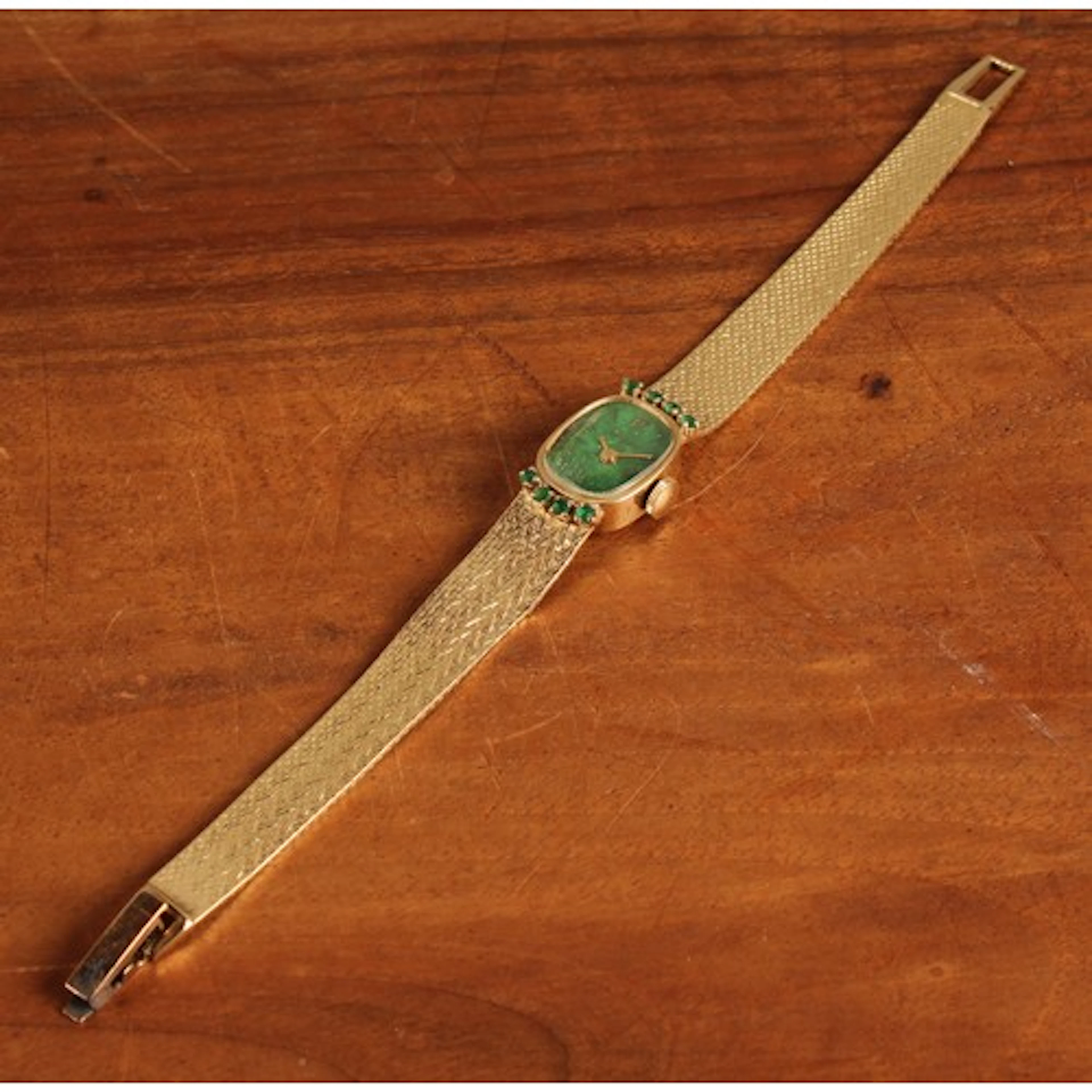 A LeCoultre 14ct gold lady's watch, oval emerald green colou...