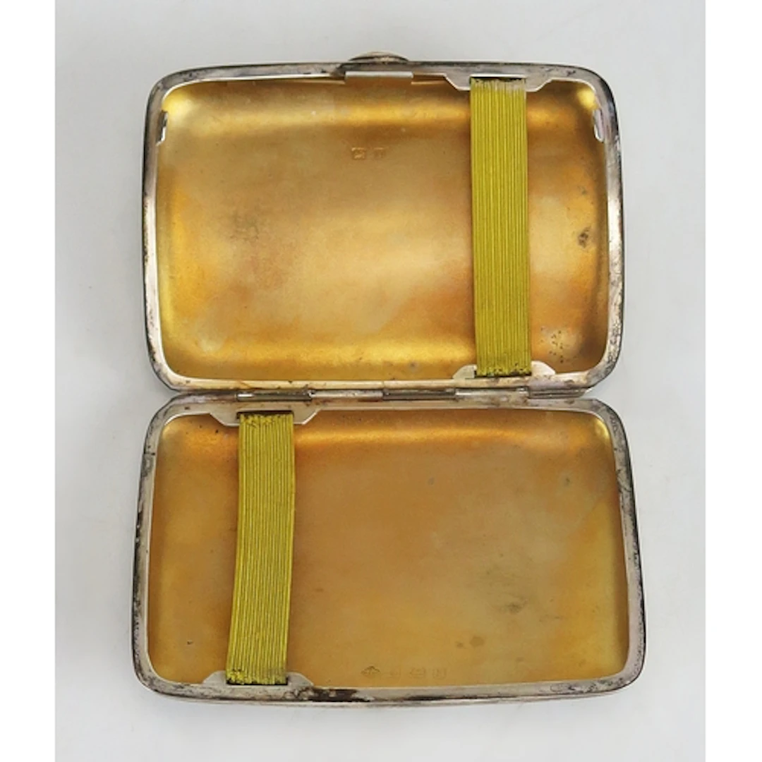 A George V silver cigarette case, maker Horace Woodward & Co...