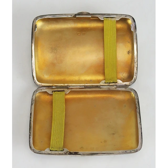 A George V silver cigarette case, maker Horace Woodward & Co...