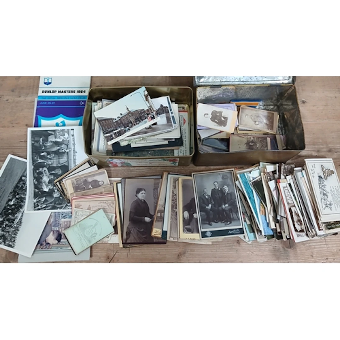 Two tins of assorted postcards and CDV cards, also including...