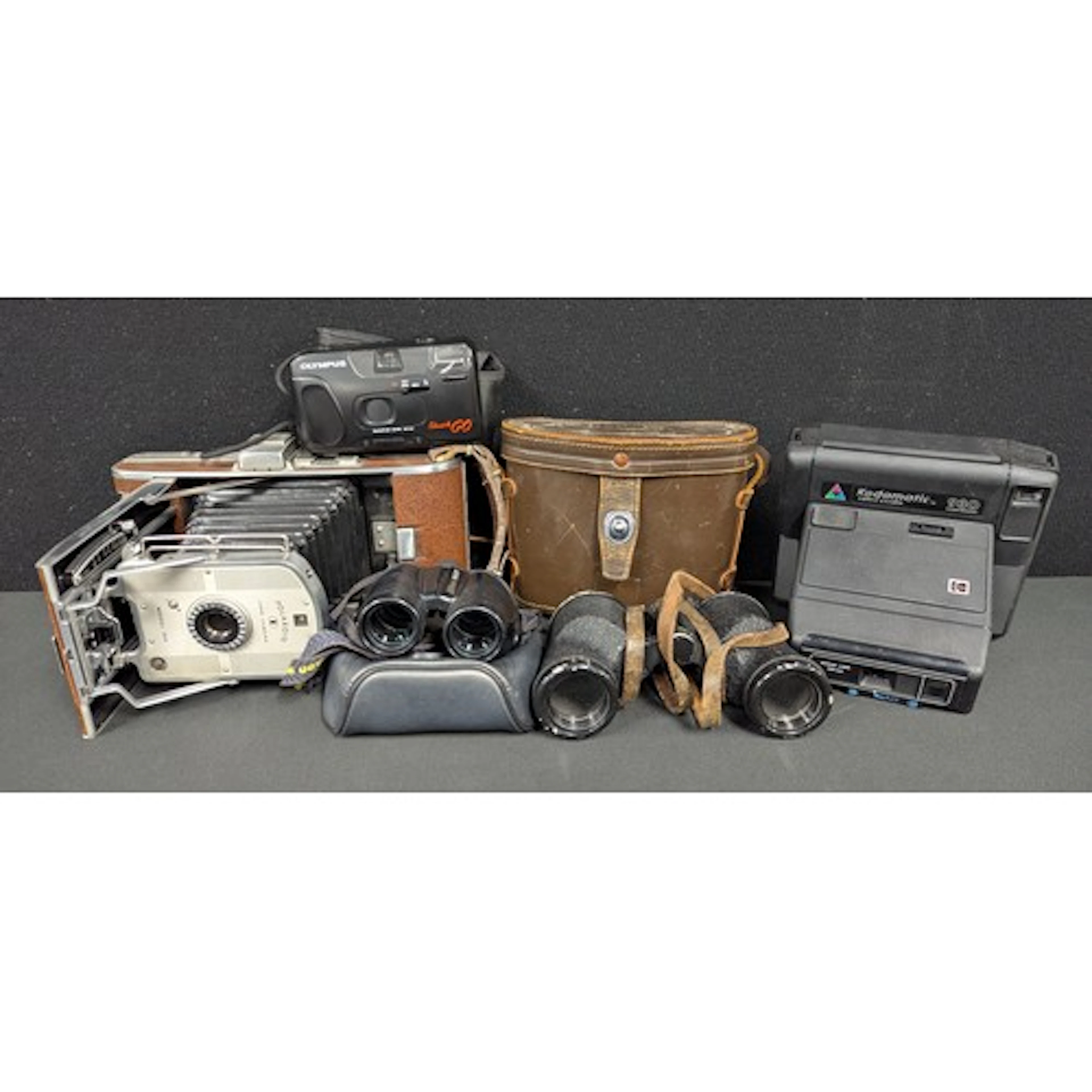A Polaroid Land Camera, model 95A, mid 20th century; a pair ...