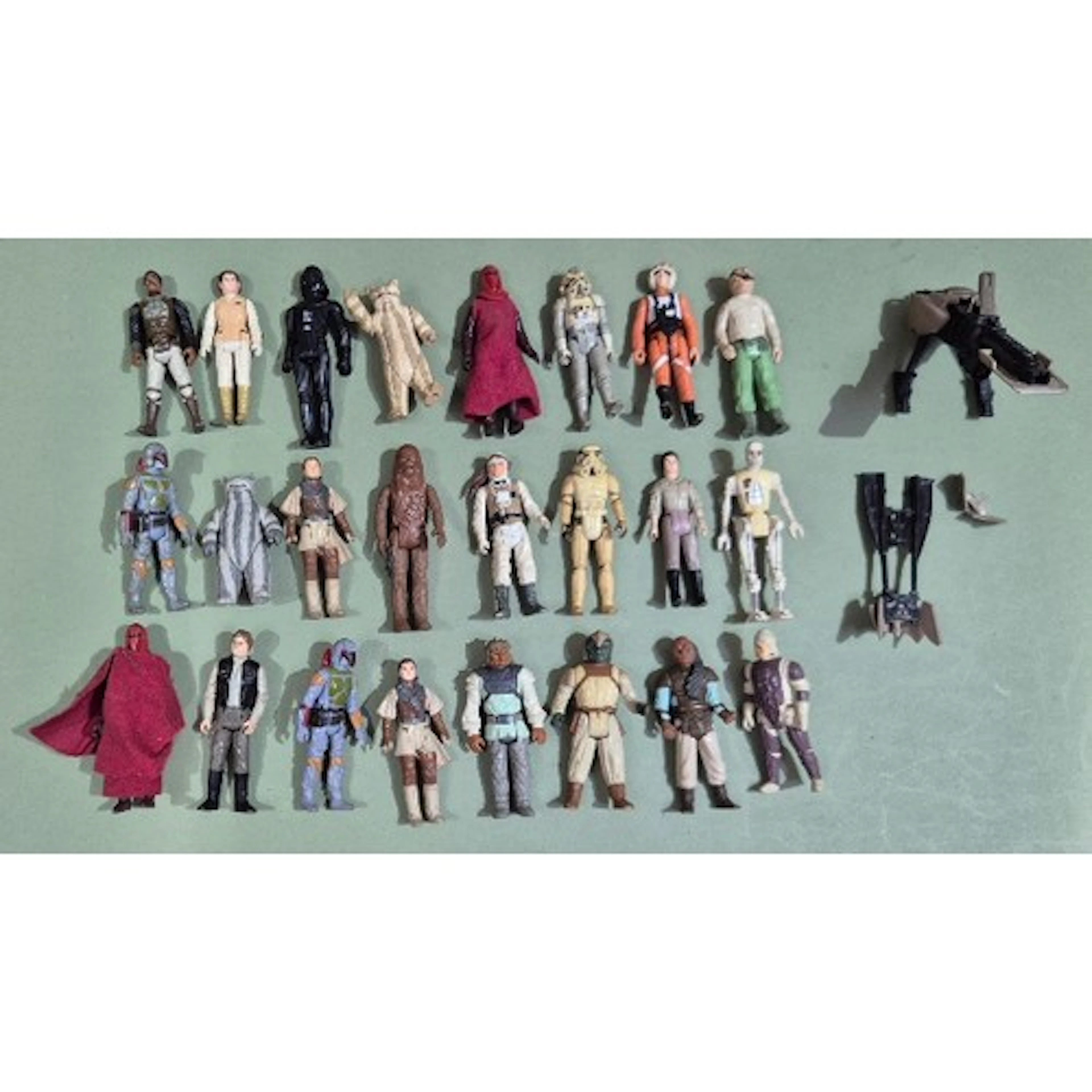 A group of 24 assorted original Star Wars figures & a speede...