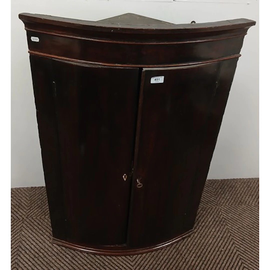 19th century mahogany bow front corner cabinet.