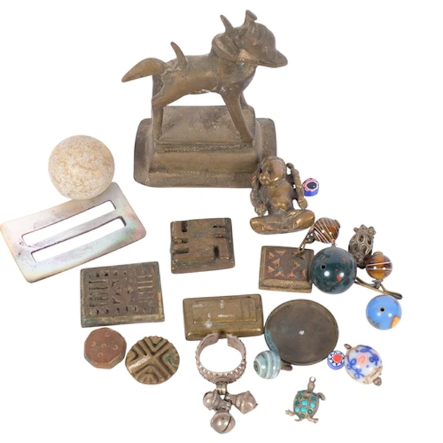 A selection of interesting collectables, including a cast-br...