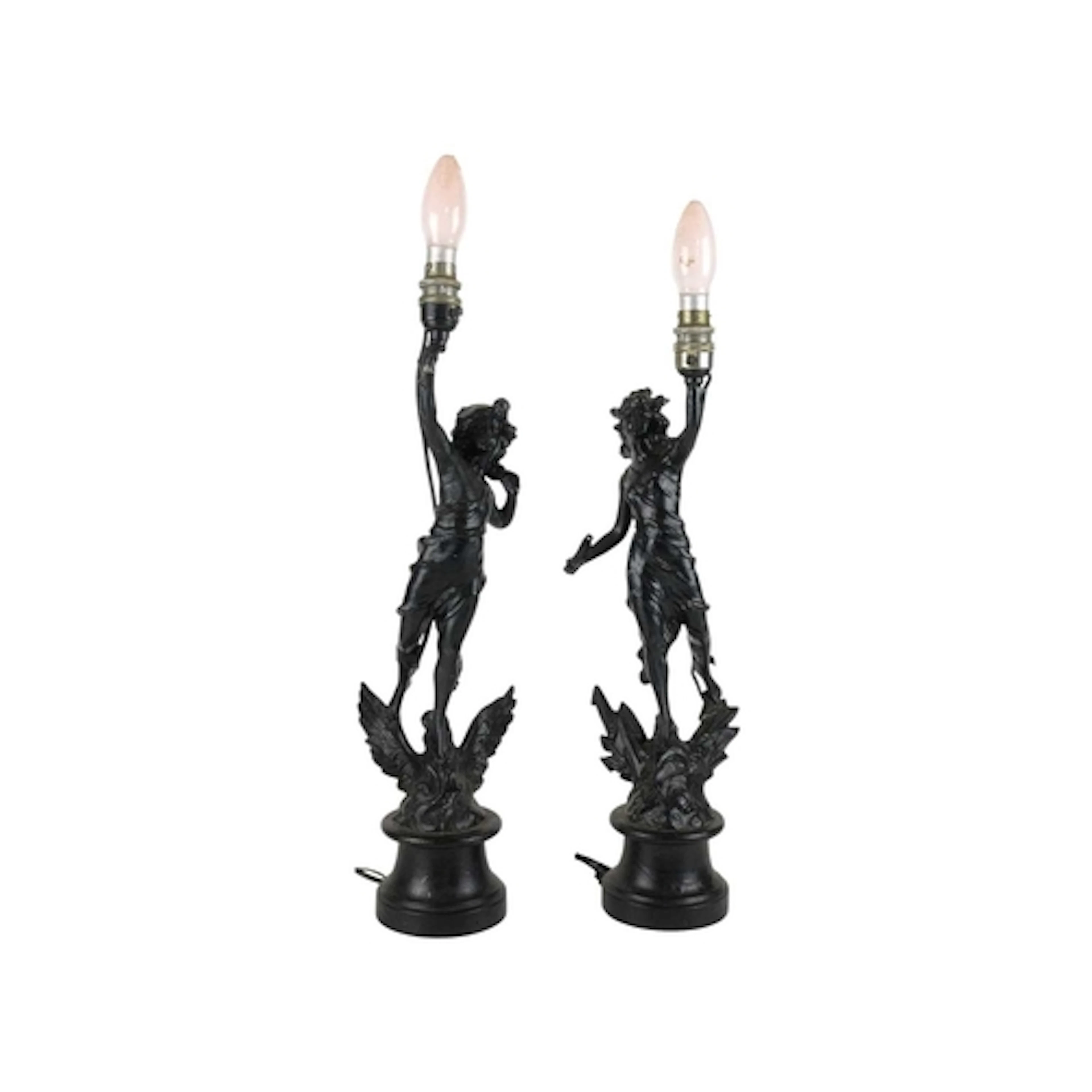 A pair of black painted spelter figural table lamps. Early 2...