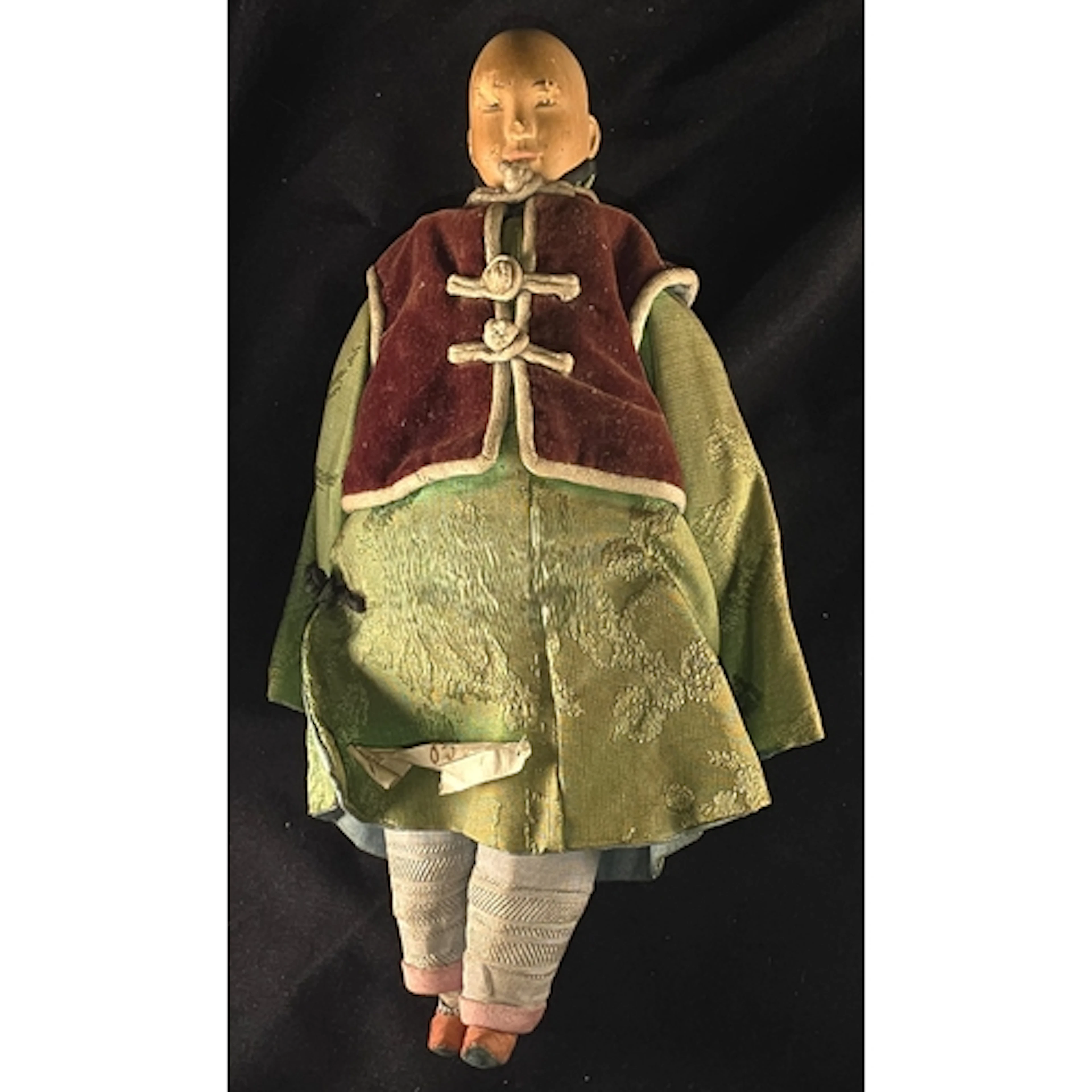 A late 19th/ early 20th century Chinese 'Door of Hope's doll...