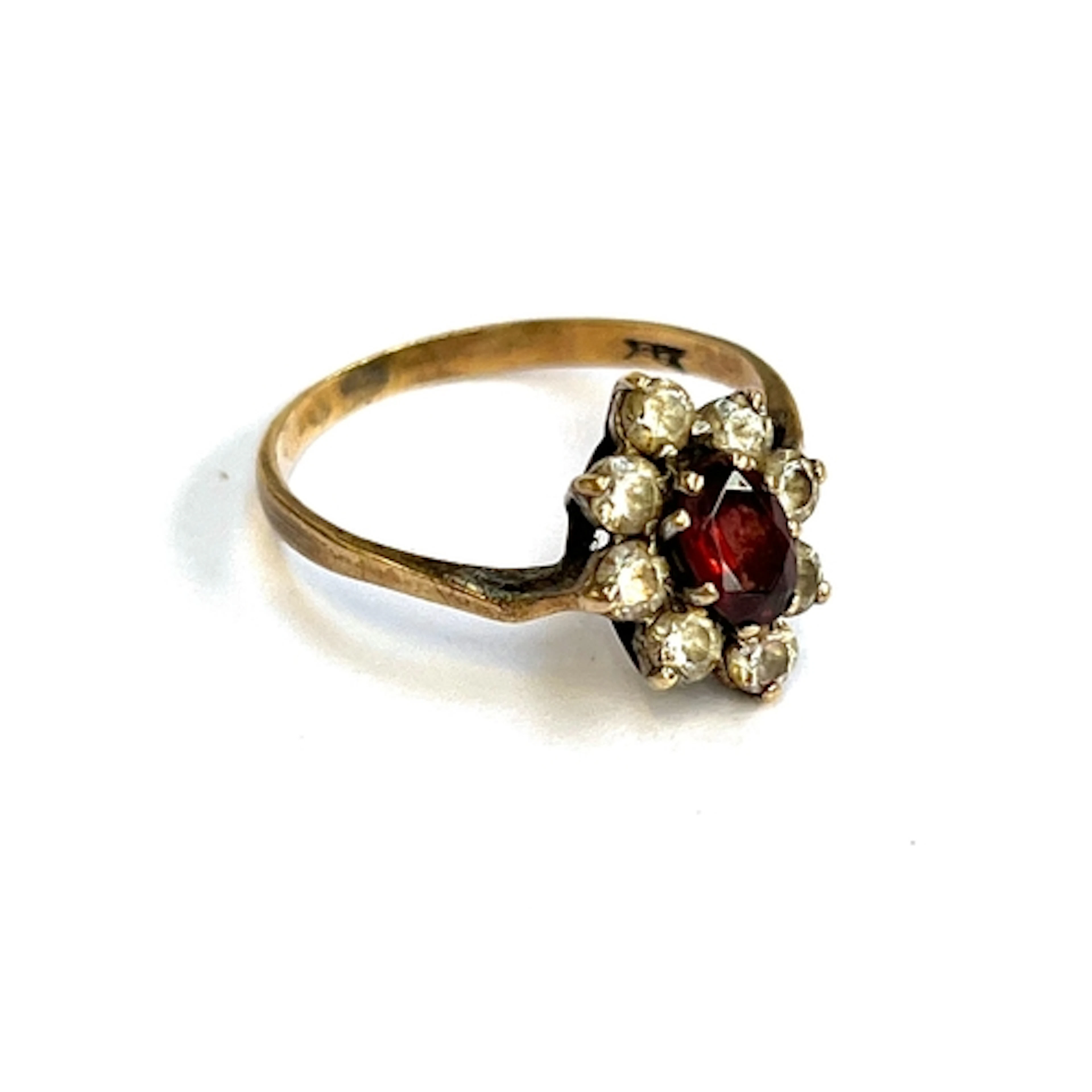 A 9ct gold, garnet and paste cluster ring (af, bent), gross ...