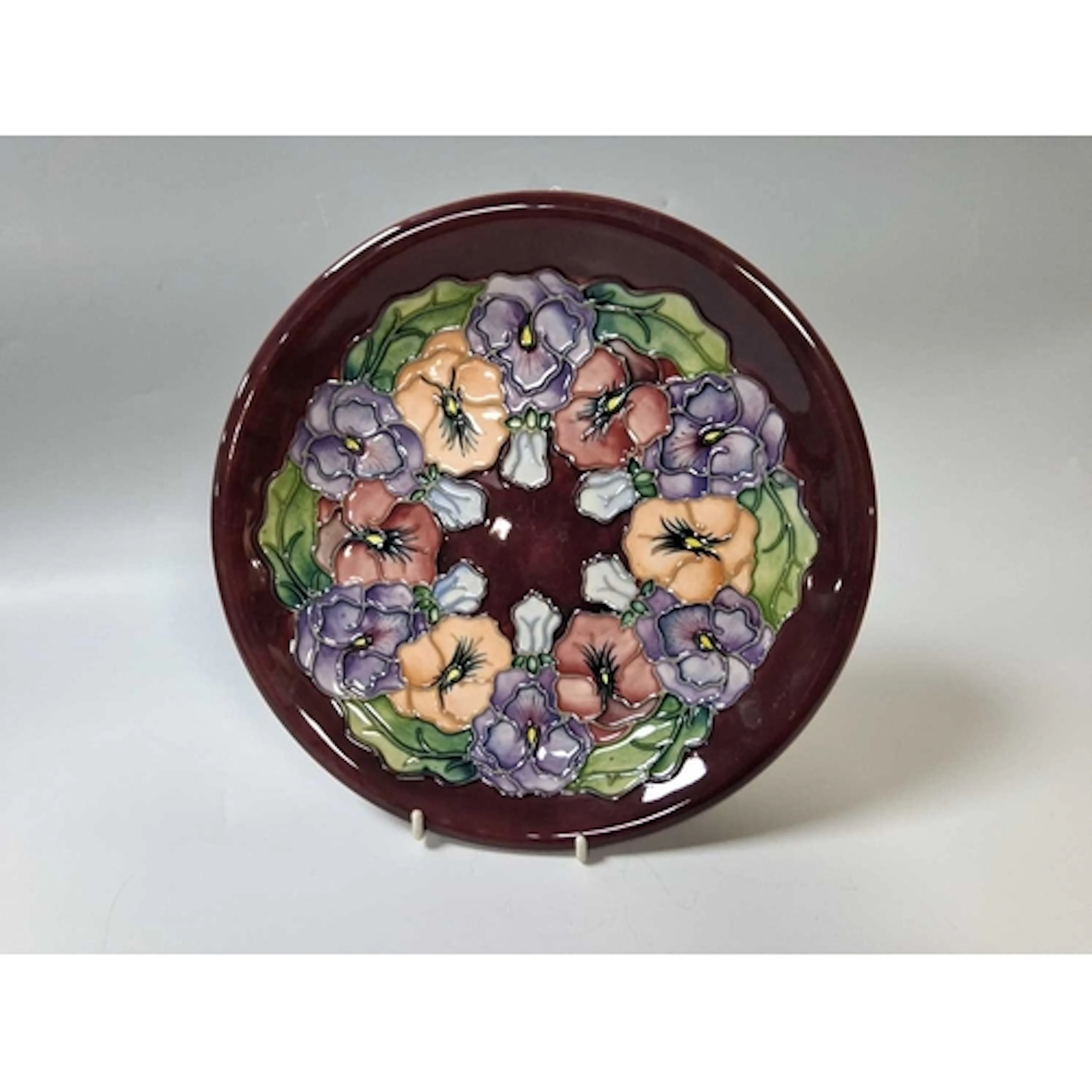 A 1994 MOORCROFT POTTERY 'PANSY' PATTERN LARGE DISPLAY PLATE...