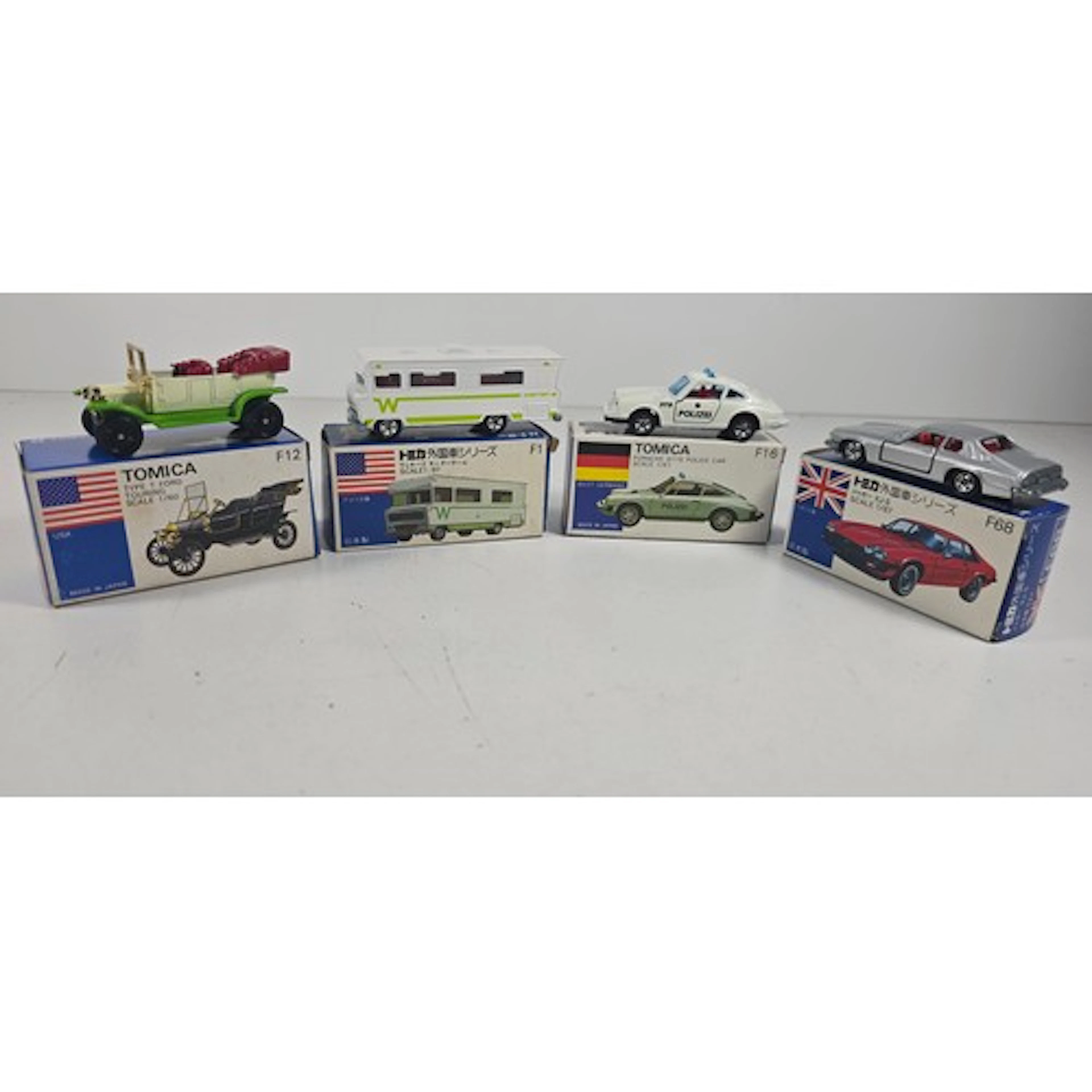4 Tomica models inc; 'Jaguar XJ-S no F68', 'Type-T-Ford Tour...