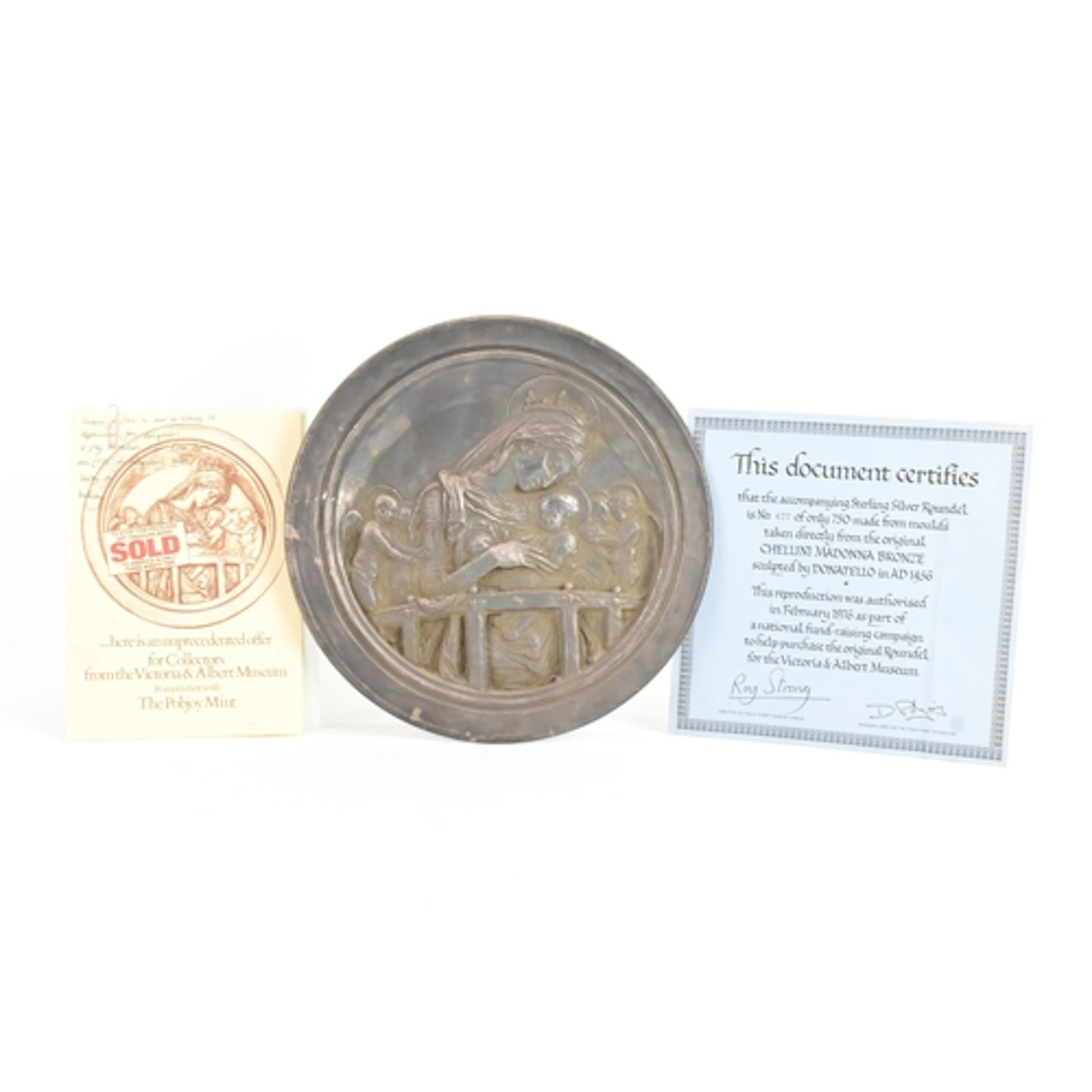 A modern silver-filled Pobjoy Mint circular wall plaque "The...