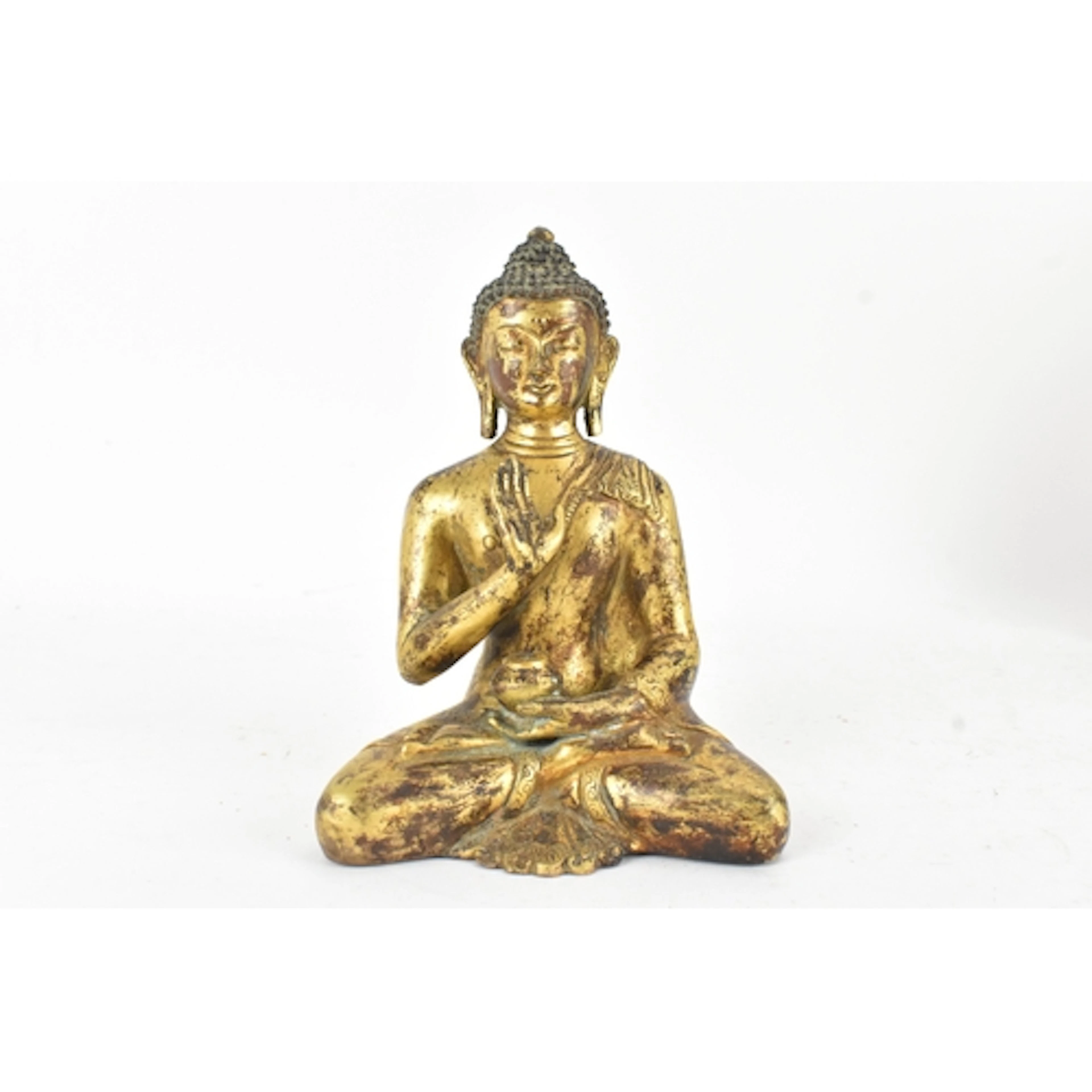 A Tibetan gilt-bronze figure of Buddha, seated in dhyanasana...