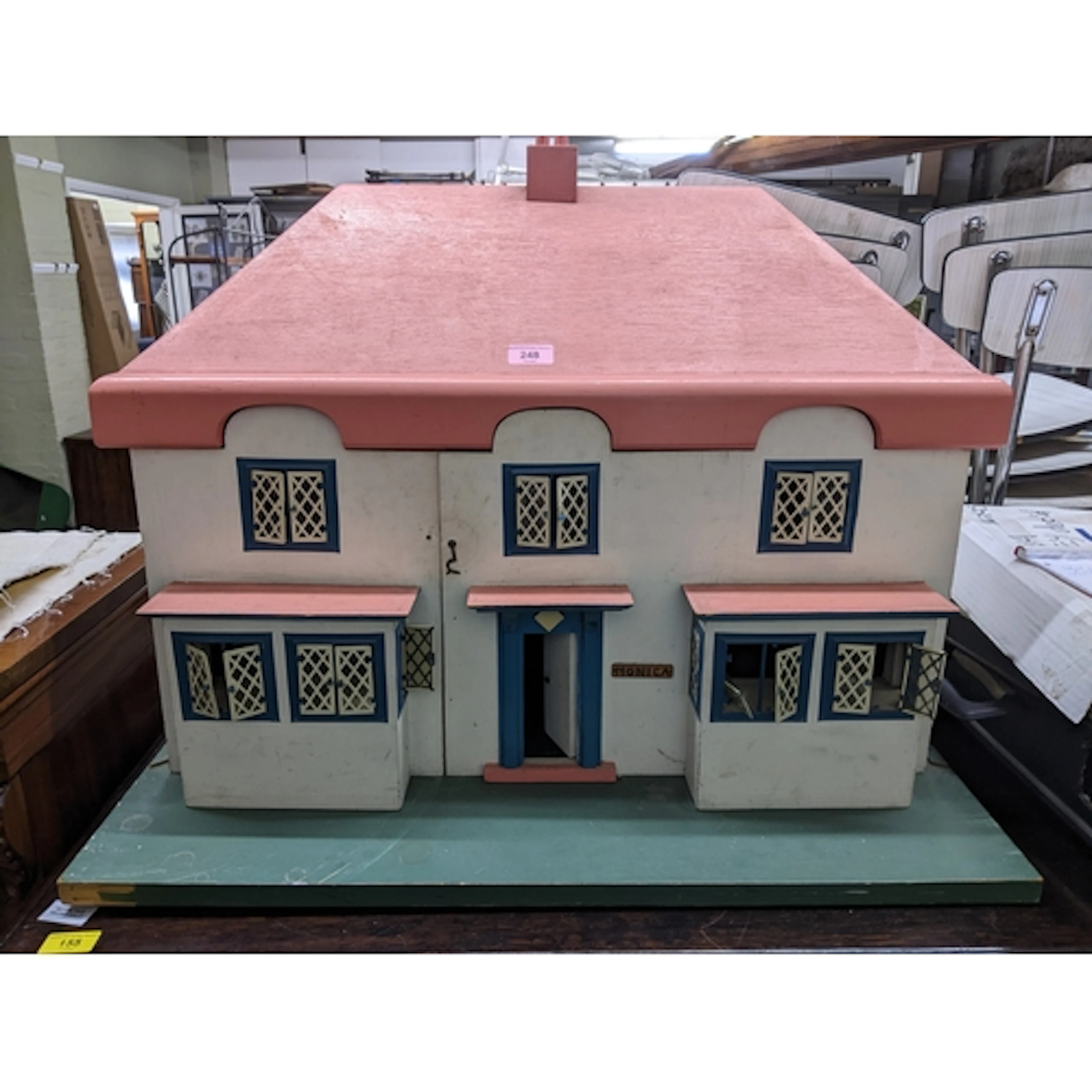 A mid-century painted wooden dolls house cottage, 59.5 x 77 ...