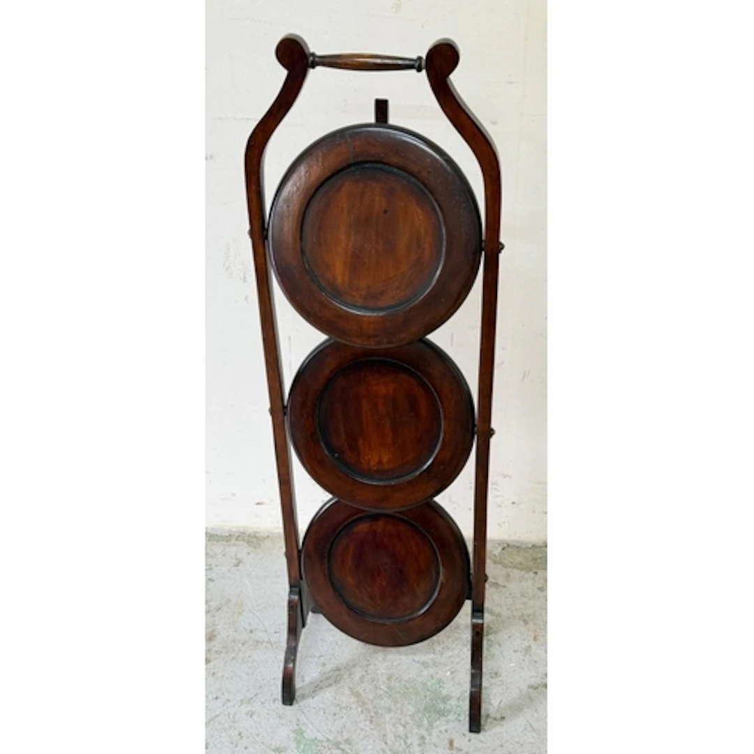 A mahogany folding cake stand.