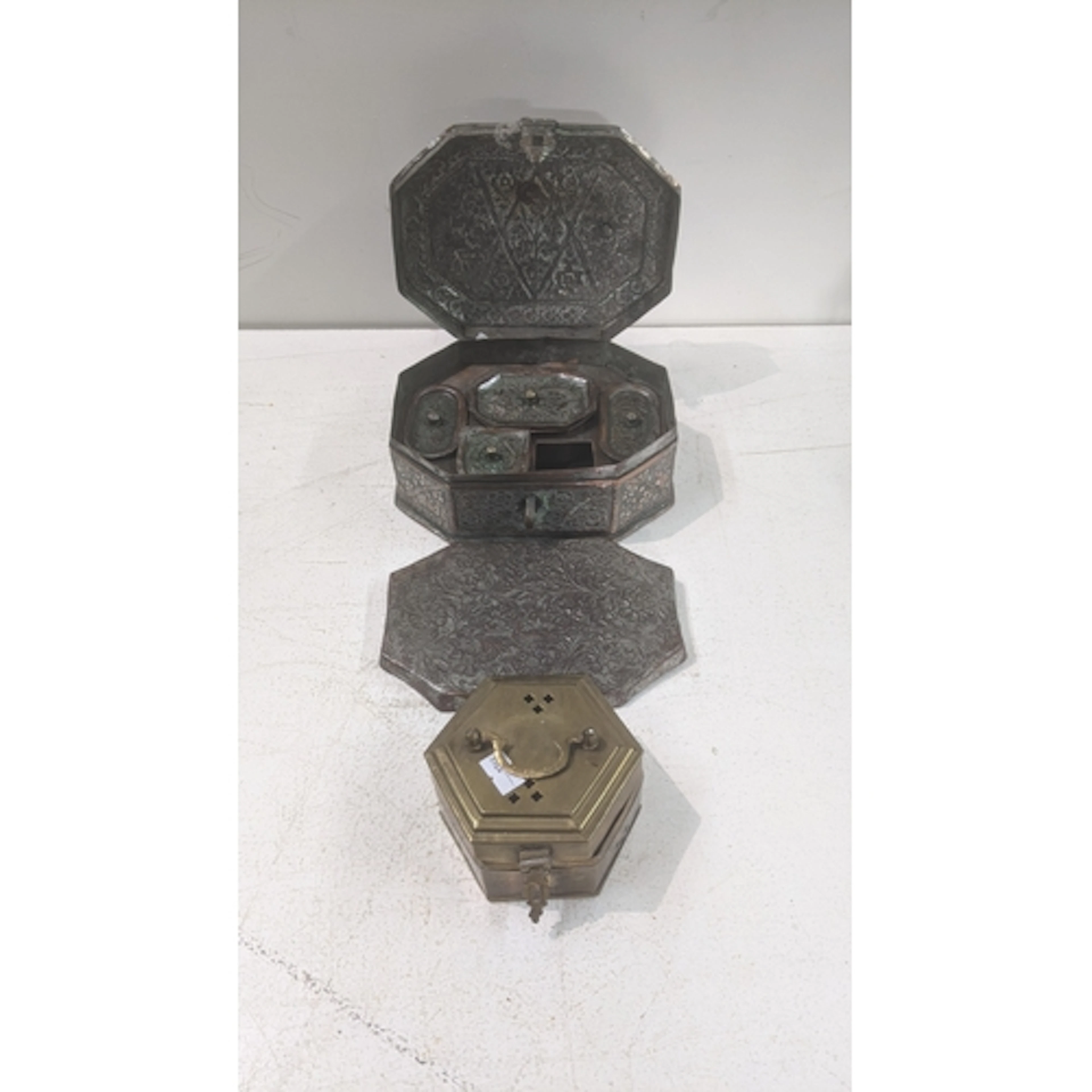 A vintage Middle Eastern copper paan daan or spice tin, havi...