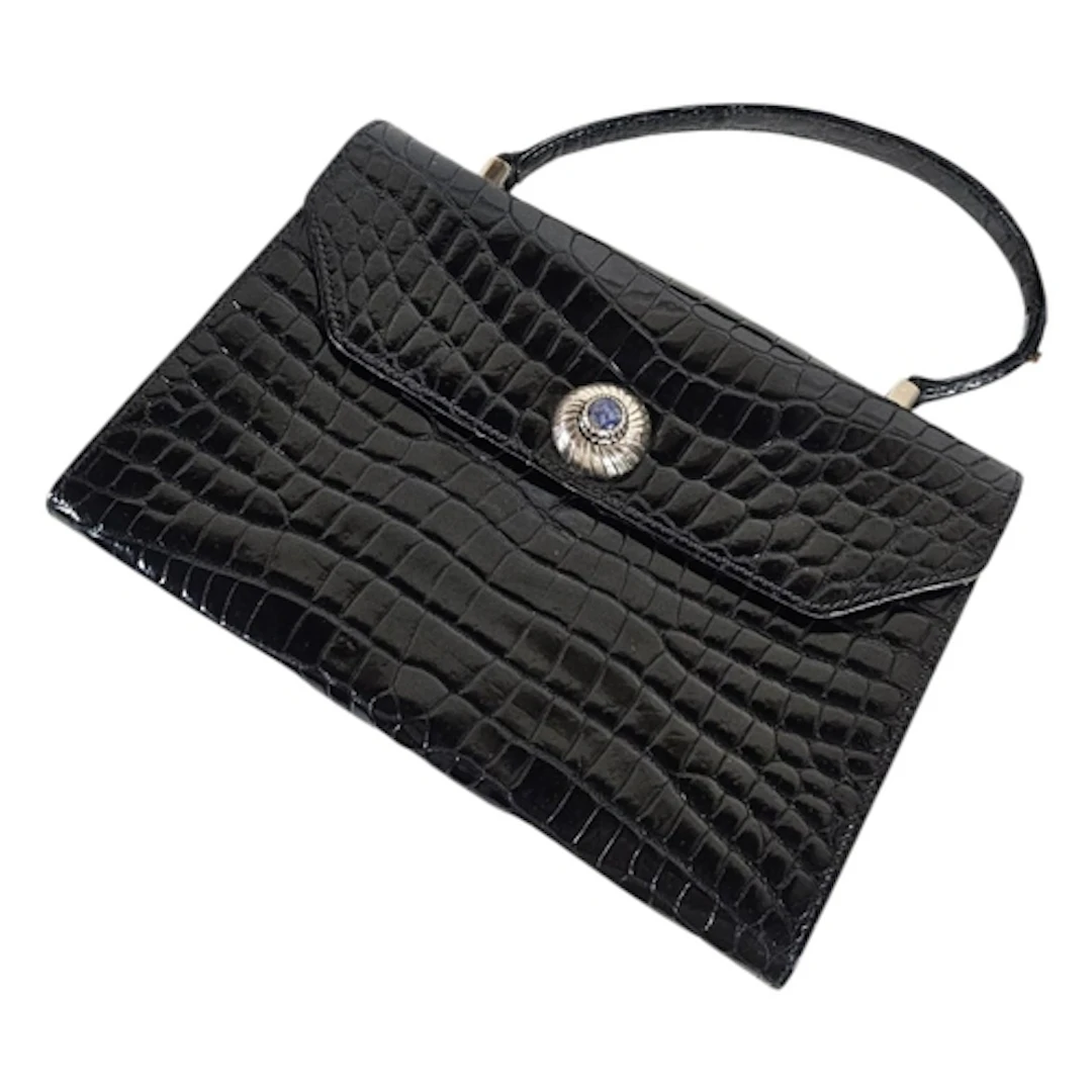A MID CENTURY BLACK CROCODILE SKIN SCULPTURED HANDBAG Silver...