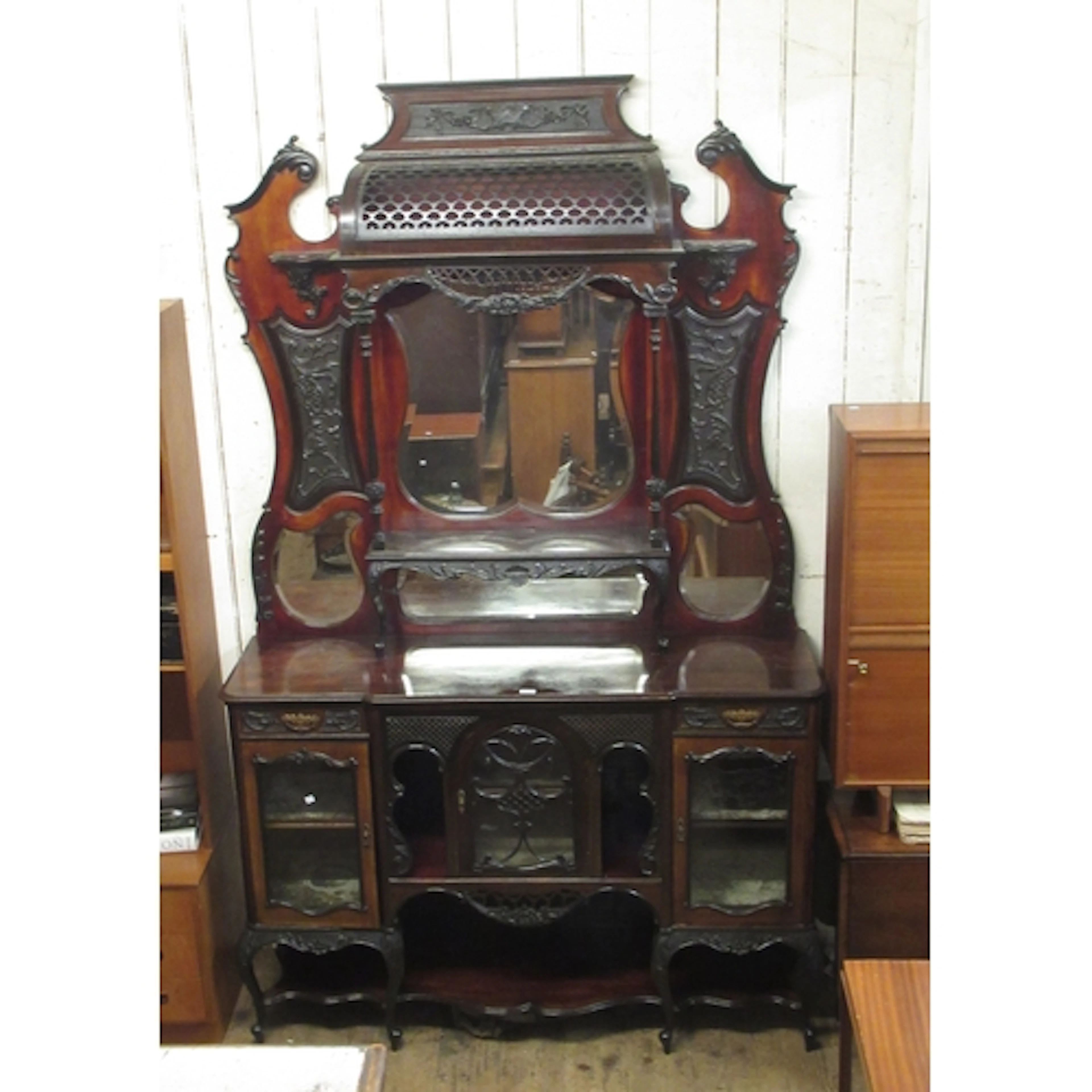 Large Edwardian mahogany chiffonier, the ornate mirrored car...
