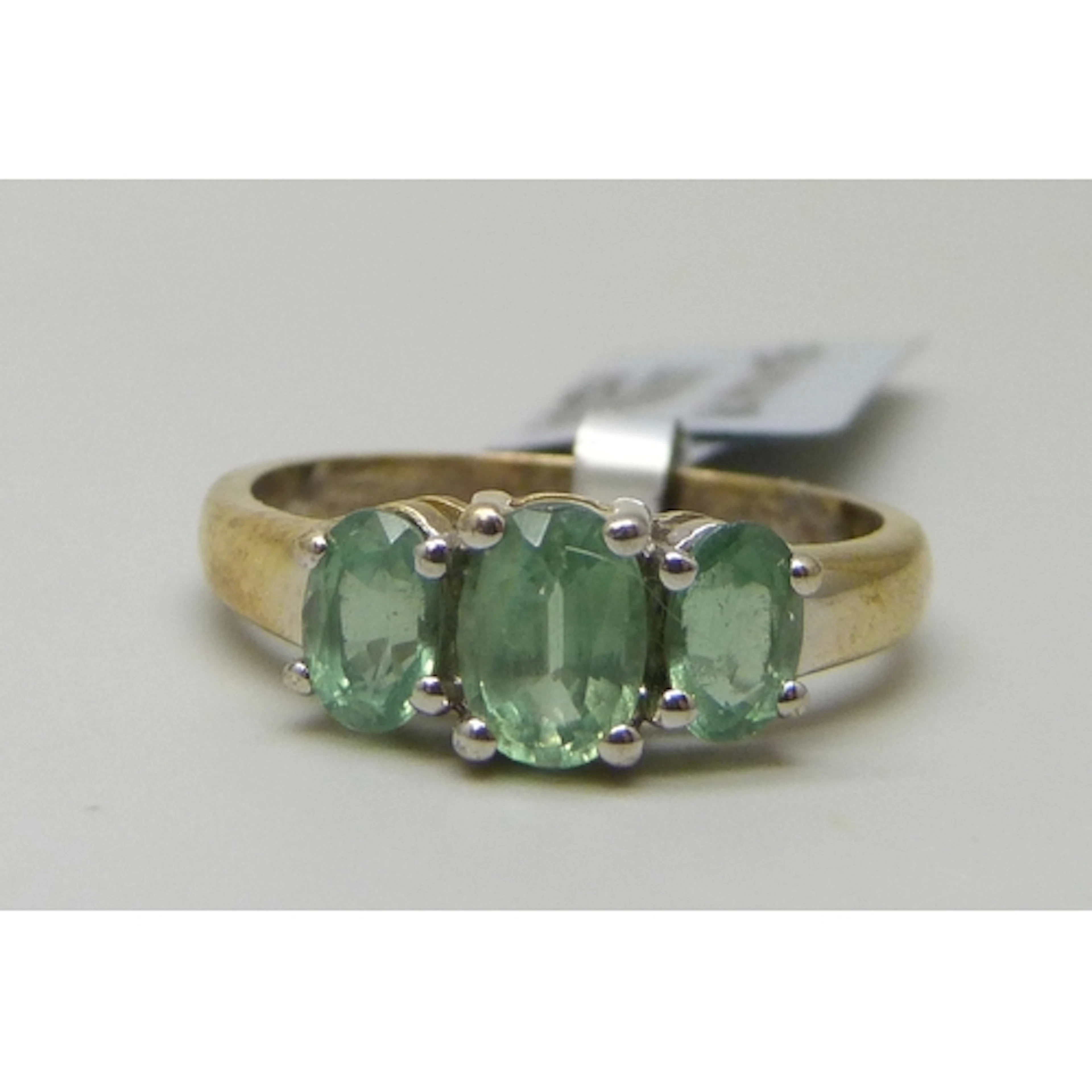 A silver gilt and possibly green kyanite three stone ring, S