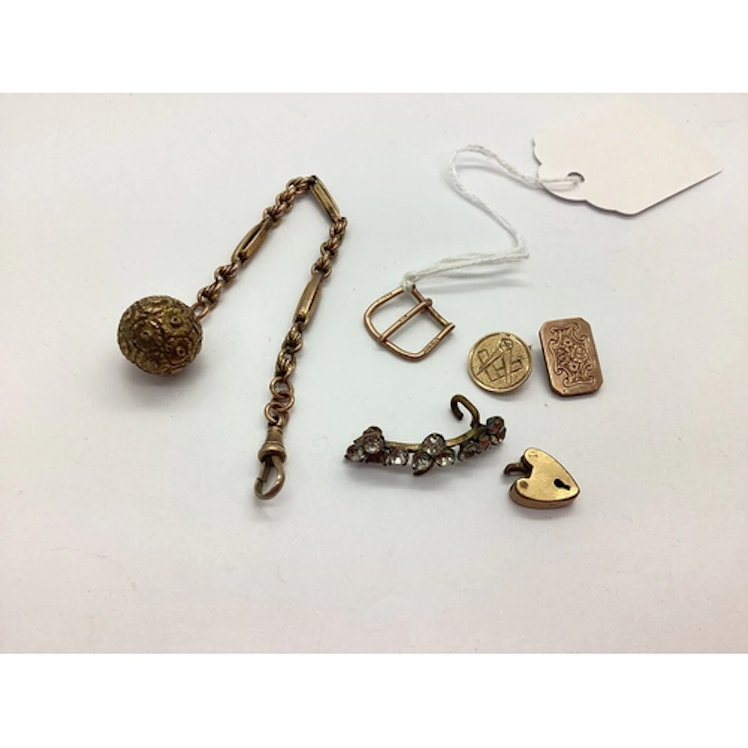 A 9ct Gold Masonic Pin, (pin bent); a 9ct gold watch strap b...