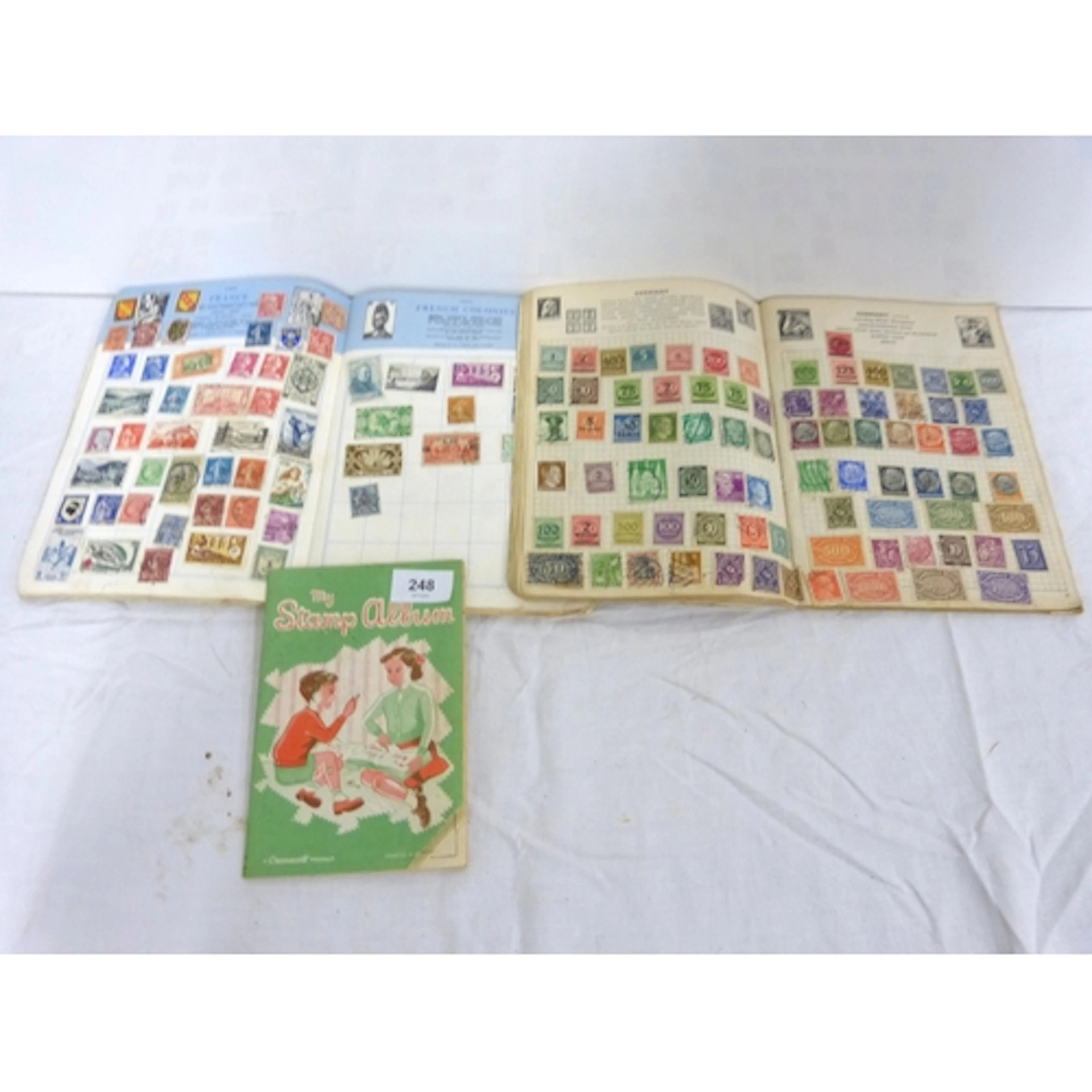Three small, World stamp albums.