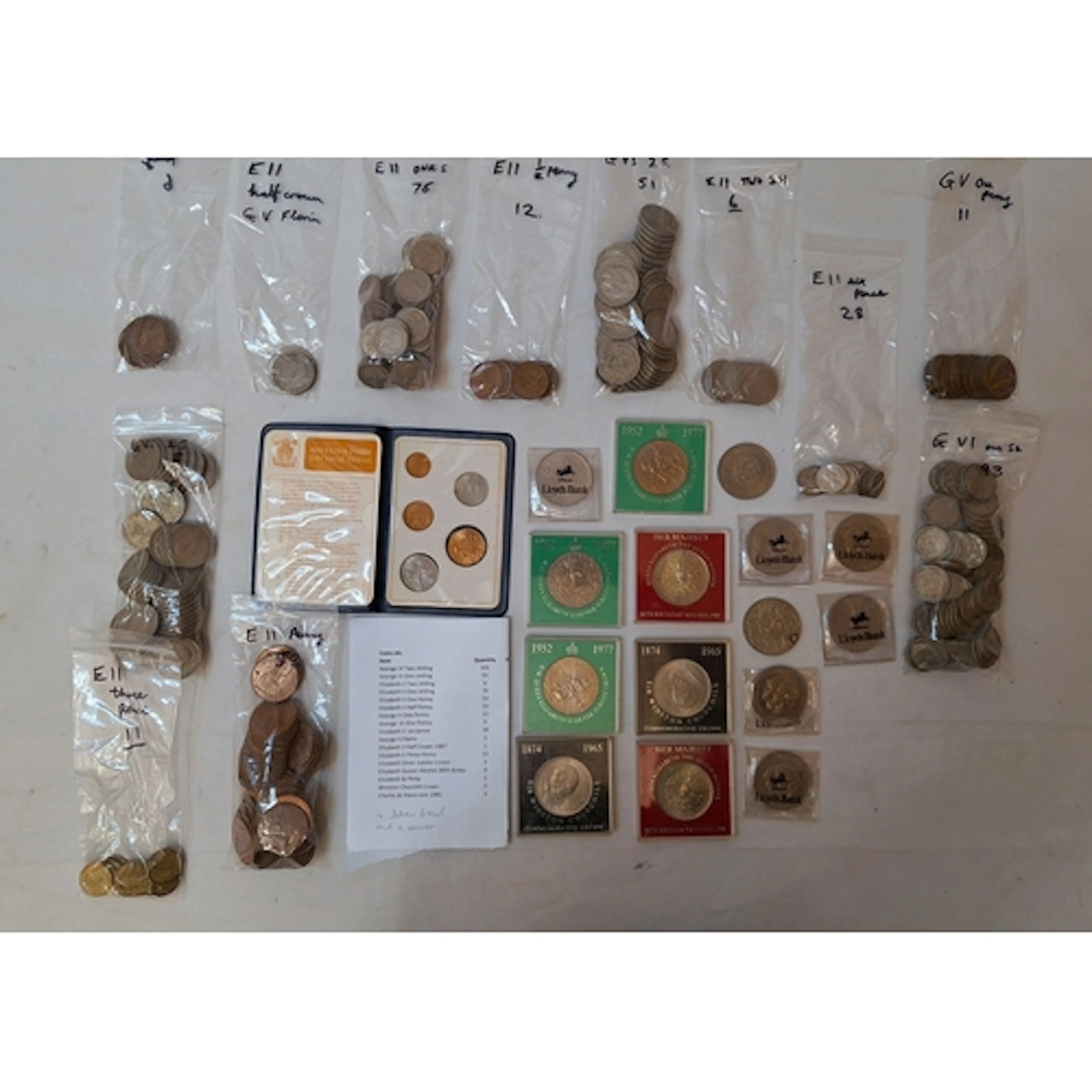 Decimal Coin Wallet, copper pennies, 101 George VI florins, ...