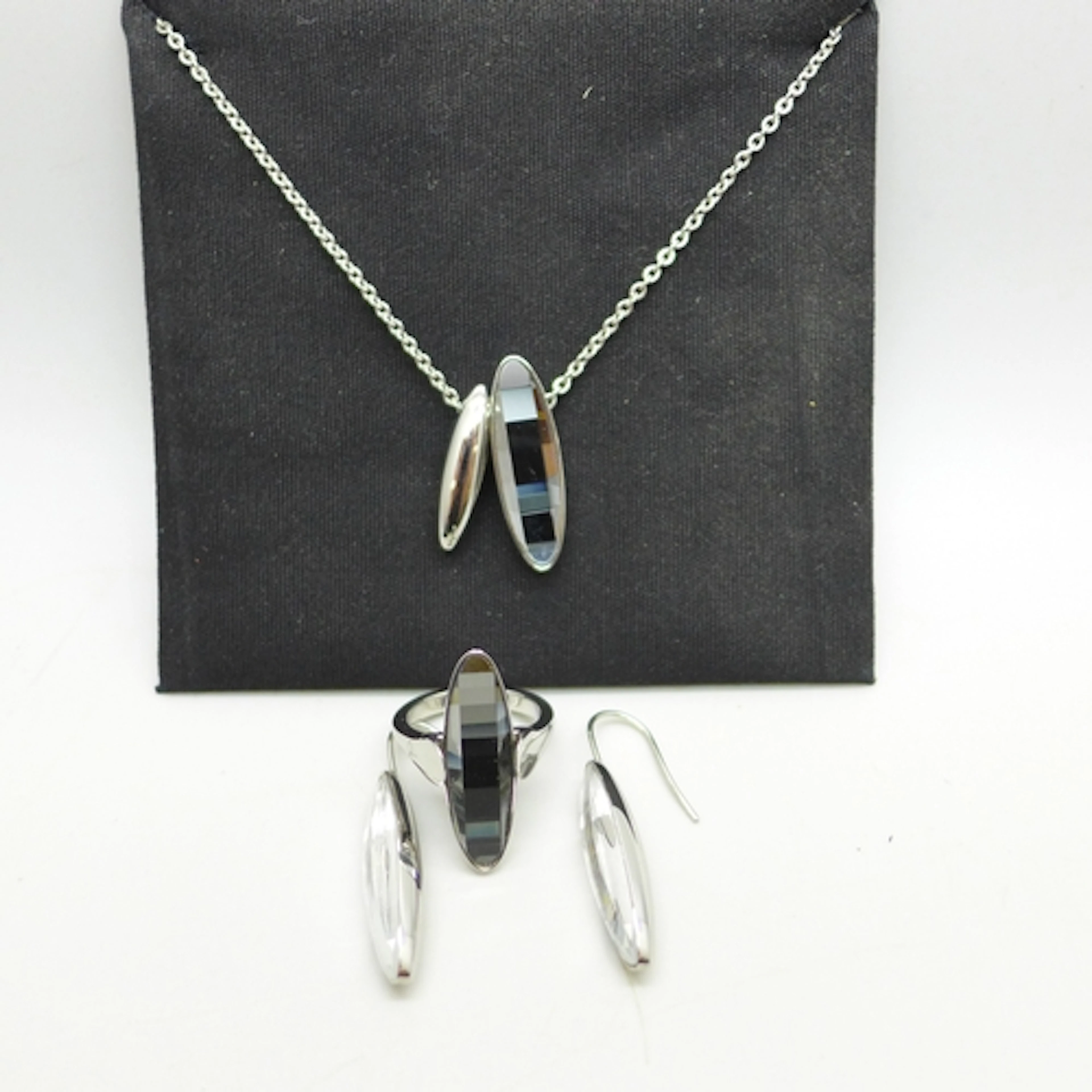 A Calvin Klein costume ring, earring and necklace set, ring ...