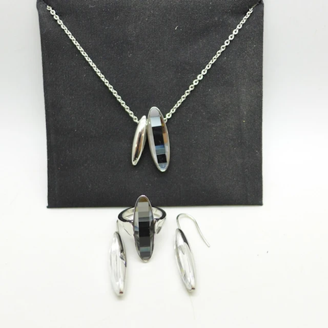 A Calvin Klein costume ring, earring and necklace set, ring ...