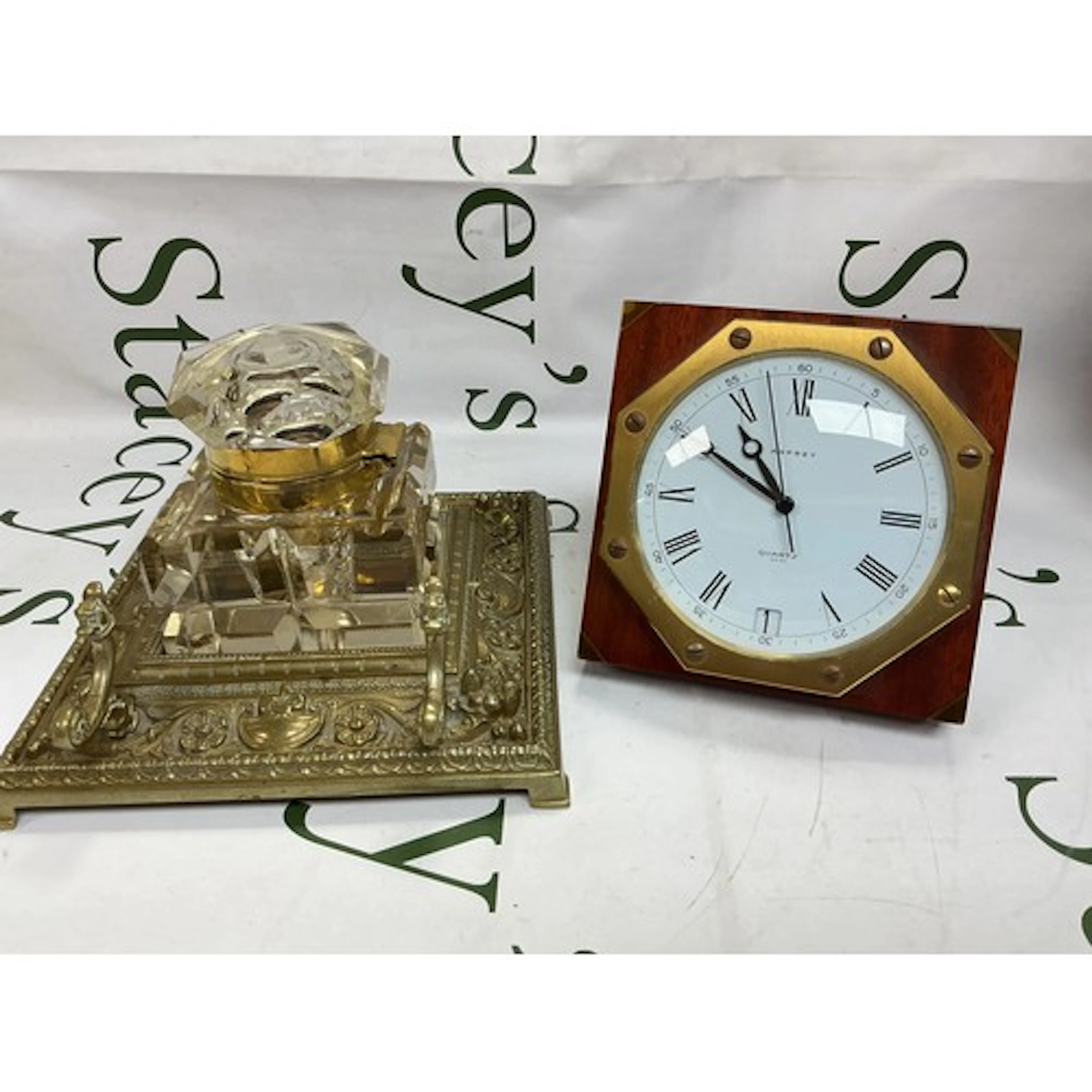 An Asprey desk clock and a large brass inkwell (2).